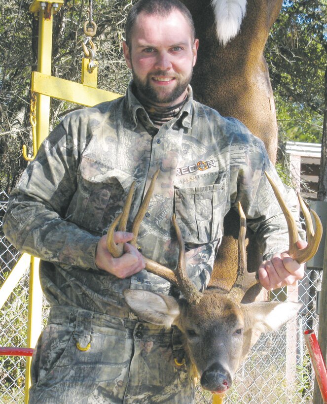 Michael Snelson showcases his Pope and Young classification buck harvested during Marine Corps Logistics Base Albany’s 2013-2014 deer season.  