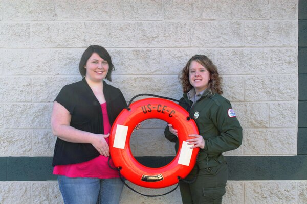 Direct Care representative and staff member Monica Chowning (Left) and  Lake Cumberland Park Ranger Ashley Glyn-Jones display a life ring preserver, which is one of the most common and most used throwable liffe saving devices. 