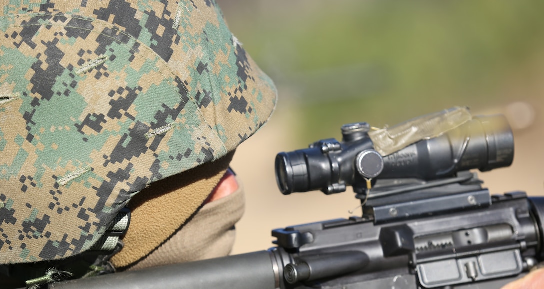 Sgt. Joel Infante fires a round at a target on Marine Corps Air Station Cherry Point’s range Jan. 7 during the table three qualification. Table three is a moving combat marksmanship course for Marines preparing to deploy. Infante is an aircraft avionics technician with Marine Light Attack Helicopter Squadron 467.
