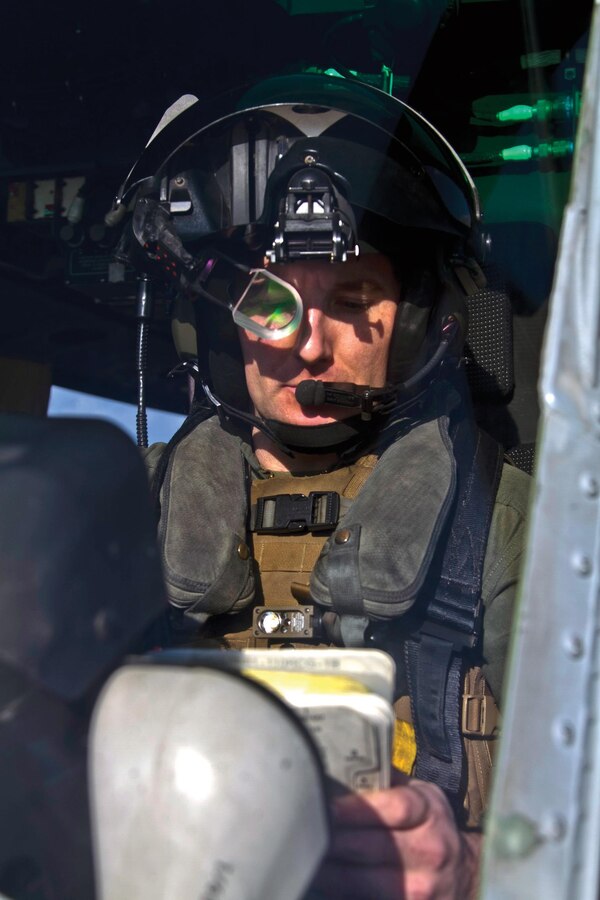 Capt. Kyle S. Wilt looks over the controls of his UH-1Y Huey helicopter during a preflight check Jan. 16 at Kadena Air Base. “Our main mission is to provide close air support for the ground troops, and our success directly affects them,” said Wilt. “This is what we do at our most basic level.” Wilt is with Marine Light Attack Helicopter Squadron 367, currently assigned to Marine Medium Tiltrotor Squadron 265 (Reinforced), 31st Marine Expeditionary Unit, III Marine Expeditionary Force.