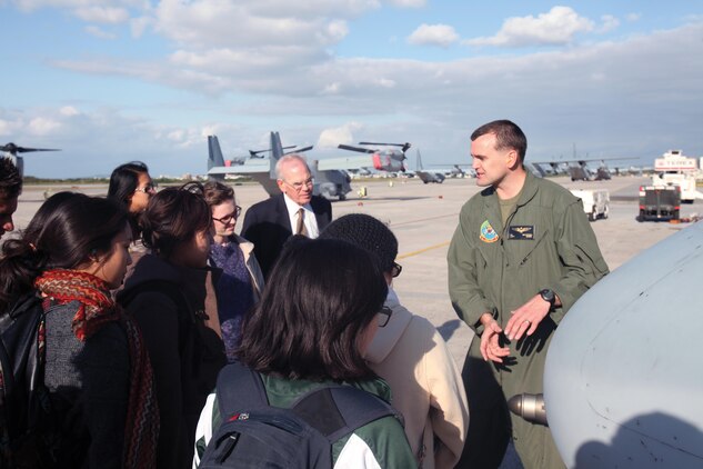 Capt. Carl E. McCrory briefs students from Soka University of America during an MV-22B Osprey tiltrotor aircraft static display Jan. 16 at the Marine Medium Tiltrotor Squadron 262 hangar at Marine Corps Air Station Futenma. During the visit, the students asked questions about U.S.-Japan military and government relations to facilitate an understanding from personal experience. McCrory is a pilot with Marine Medium Tiltrotor Squadron 262, 1st Marine Aircraft Wing, III Marine Expeditionary Force. Photo by Cpl. Terry Brady