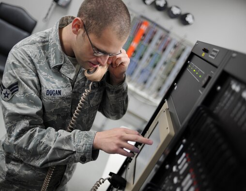 YOKOTA AIR BASE, Japan -- Senior Airman Lucas Dugan, 374th Communications Squadron airfield systems technician checks a radio frequency at Yokota Air Base, Japan, Jan. 17, 2014. Air traffic controllers rely heavily on these radios, if any of the equipment fails; this directly affects mission effectiveness by possibly shutting down the airfield. (U.S. Air Force photo by Staff Sgt. Andrea Salazar/Released)