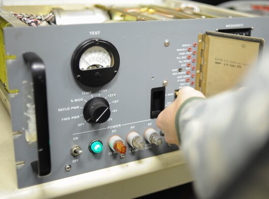 YOKOTA AIR BASE, Japan -- Airman 1st Class Montana Diehl, 374th Communications Squadron airfield systems technician, performs a maintenance inspection on a transceiver radio at Yokota Air Base, Japan, Jan. 17, 2014. Maintaining these systems is the job of the airfield systems Airmen whose mission is to fix and maintain airfield equipment and radio communications. (U.S. Air Force photo by Staff Sgt. Andrea Salazar/Released)