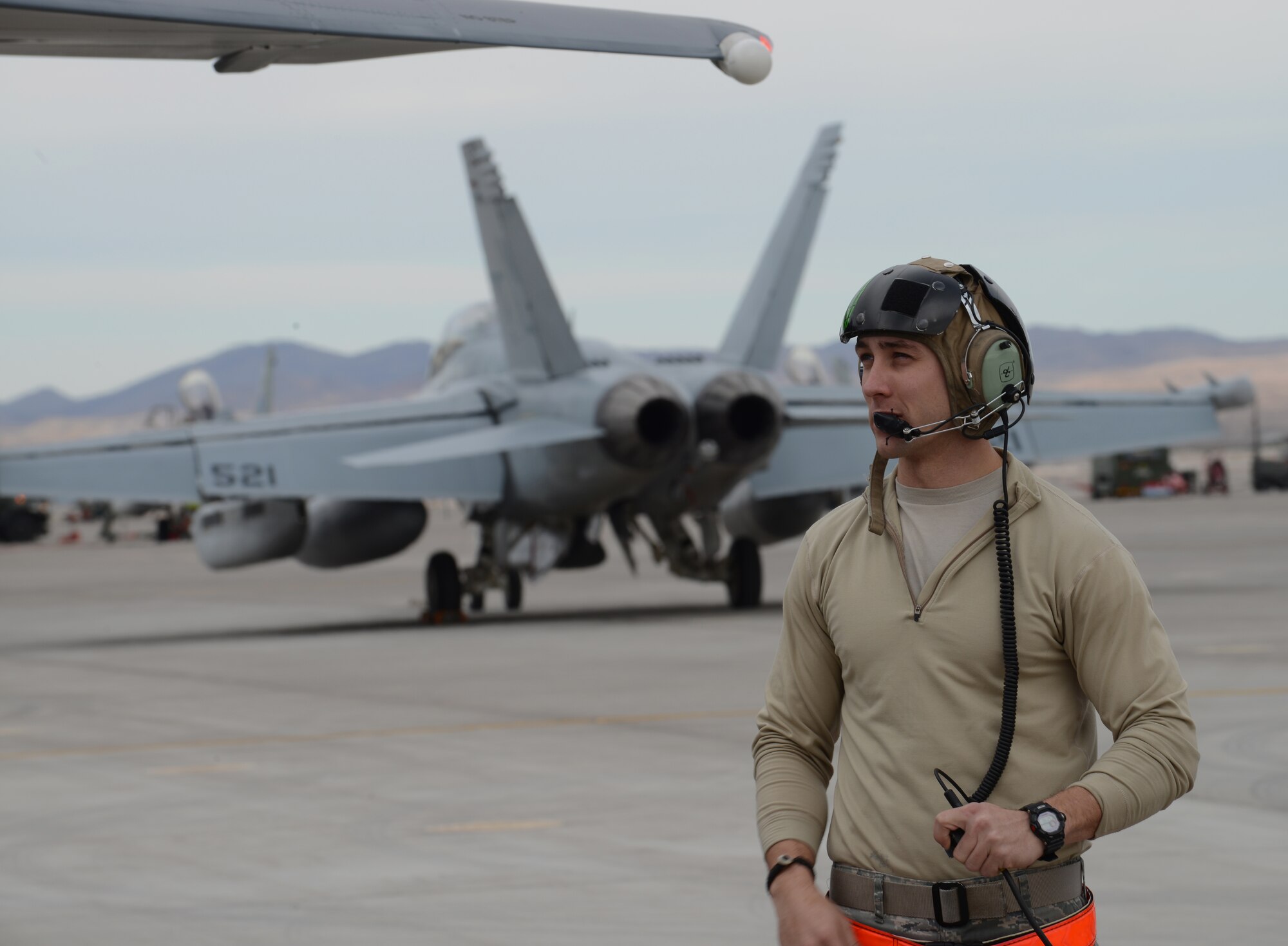 Staff Sgt. Jacob Largon, 366th Aircraft Maintenance Squadron avionics specialist,  speaks with the aircrew of an F-15E Strike Eagle Jan. 23, 2013, at Nellis Air Force Base, Nev. Members of the 366th Fighter Wing, Mountain Home Air Force Base, Idaho, arrived today and will participate in the combat exercise Red Flag 14-1. (U.S. Air Force photo by Senior Airman Benjamin Sutton/Released)