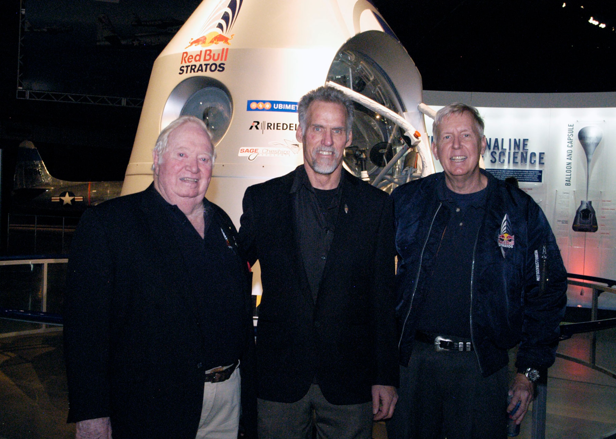 The Red Bull Stratos exhibit will be on display at the National Museum of the U.S. Air Force from Jan. 24-March 16, 2014. (left to right) Col. (Ret.) Joe Kittinger, director of flight operations and safety for the Red Bull Stratos mission, Art Thompson, technical project director, and Dr. Jonathan Clark, medical director, were at the museum for the grand opening on Jan. 23. (U.S. Air Force photo)