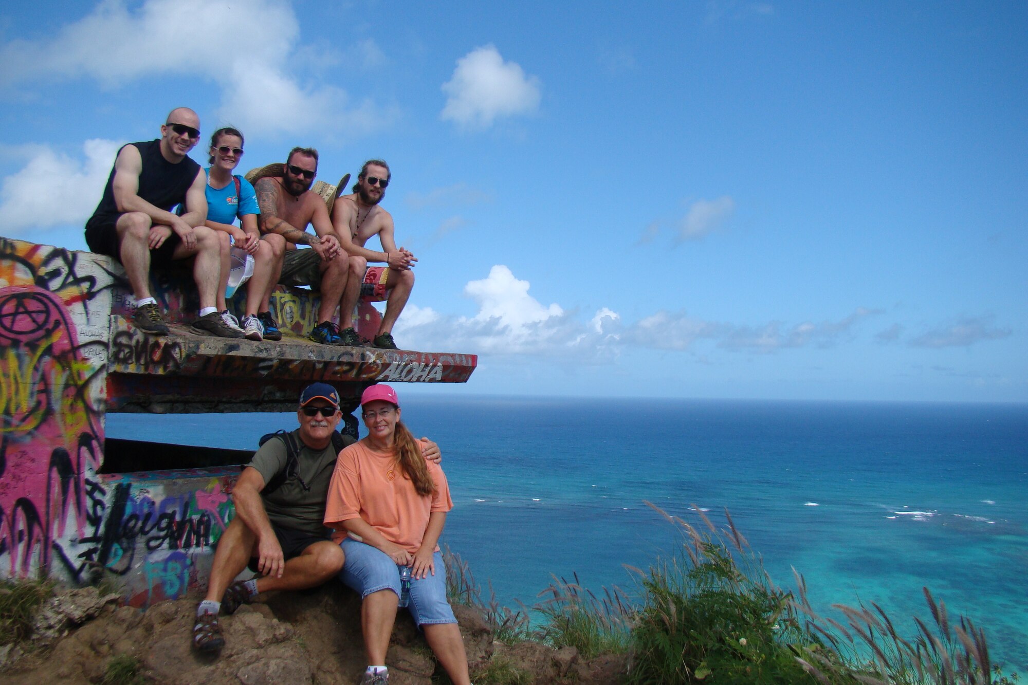 Chief Master Sgt. Paul Koester, the oldest active-duty chief, and members of his family at the Lanikai Pillboxes in Kailua, Hawaii, early 2013.   His son Ryan (top left), daughter Erin, Nick, and son Zach with Chief Koester and wife Stacey (bottom row).  Koester said of his family, “I couldn’t be more proud of my five children. They and my wife are the driving force behind all that I’ve been lucky enough to accomplish and experience. I’ve been extremely blessed as far as family, including my Air Force family.” (Courtesy photo)