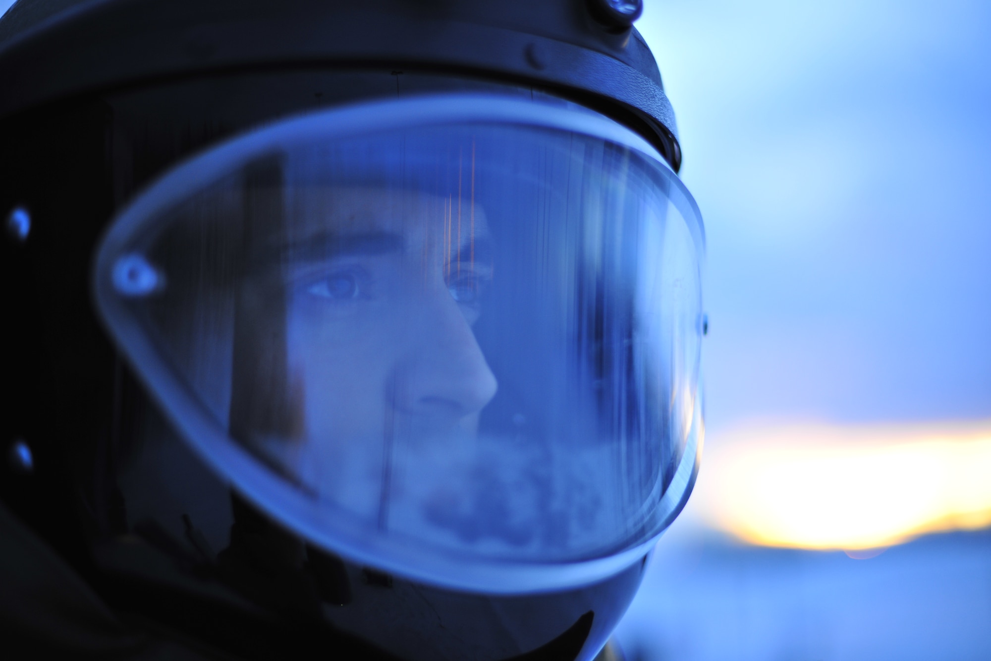 U.S. Air Force Staff Sgt. Joseph Riemer, 354th Civil Engineer Squadron explosive ordnance disposal technician, looks through an EOD 9 bomb suit Jan. 21, 2014, Eielson Air Force Base, Alaska. Riemer recently applied combat life-saver techniques to a Papua New Guinea local during a deployment. (U.S. Air Force photo by Staff Sgt. Jim Araos/Released)