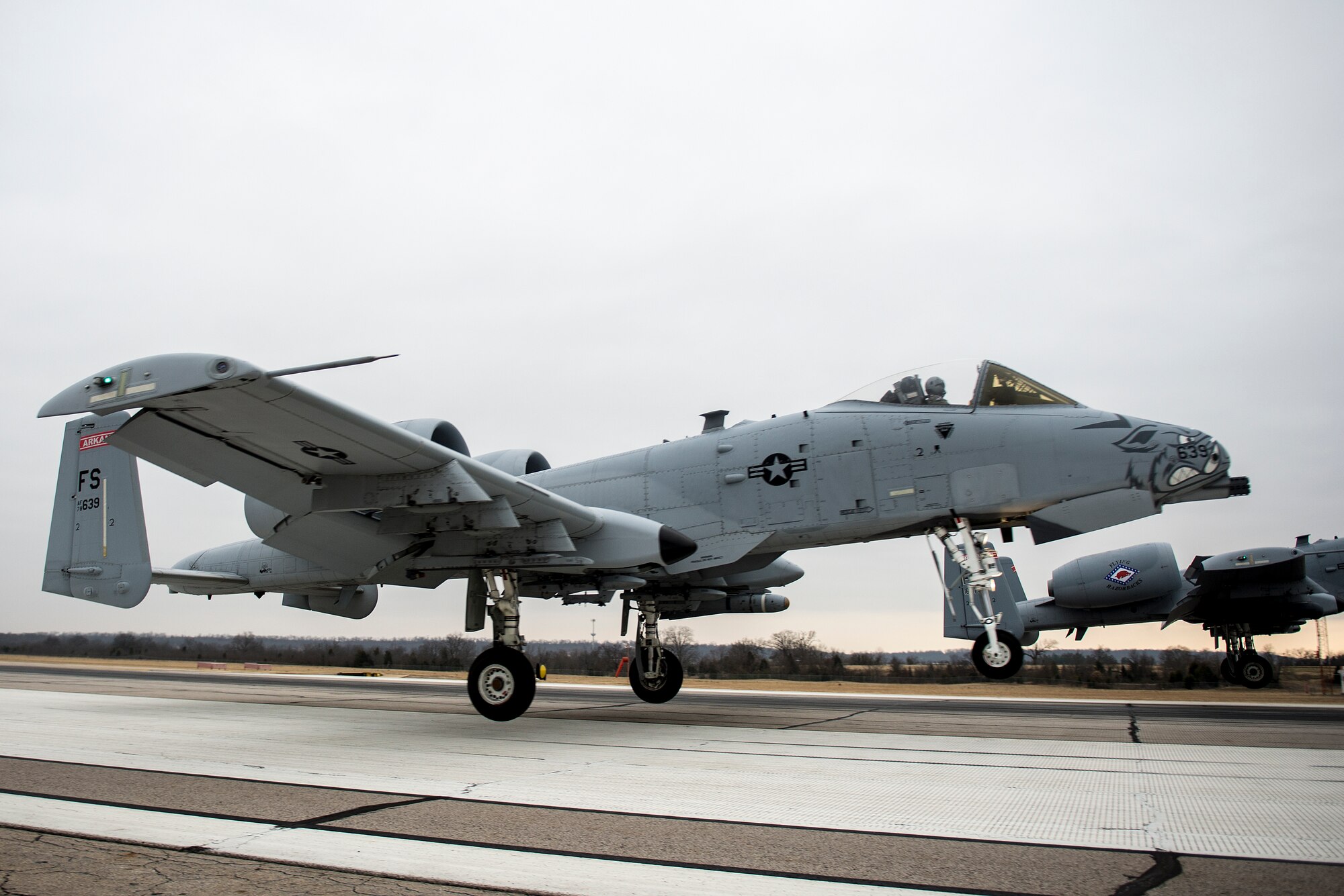 Col. Mark Anderson (Tail No. 188), 188th Fighter Wing commander, and Maj. Doug Davis (Tail No. 639), 188th Detachment 1 commander, prepare to land at Ebbing Air National Guard Base, Fort Smith, Ark., following a training mission Dec. 30, 2013. The sortie was one of the last four-ship training missions that will be conducted at the 188th. The wing is currently transitioning from a fighter mission to an Intelligence, Surveillance and Reconnaissance/remotely piloted aircraft (MQ-9 Reaper) mission that will also feature a space-focused targeting squadron. The 188th has divested two A-10C Thunderbolt II “Warthogs” per month since September 2013. The last Warthog is slated to leave the 188th in June 2014. The 188th has flown A-10s since April 2007 and has had assigned aircraft on site since 1953. June will mark the first time in unit’s 60-year history that no assigned military aircraft will be parked on the flightline at Ebbing ANG Base. (U.S. Air Force photo by Senior Airman Matthew Bruch)