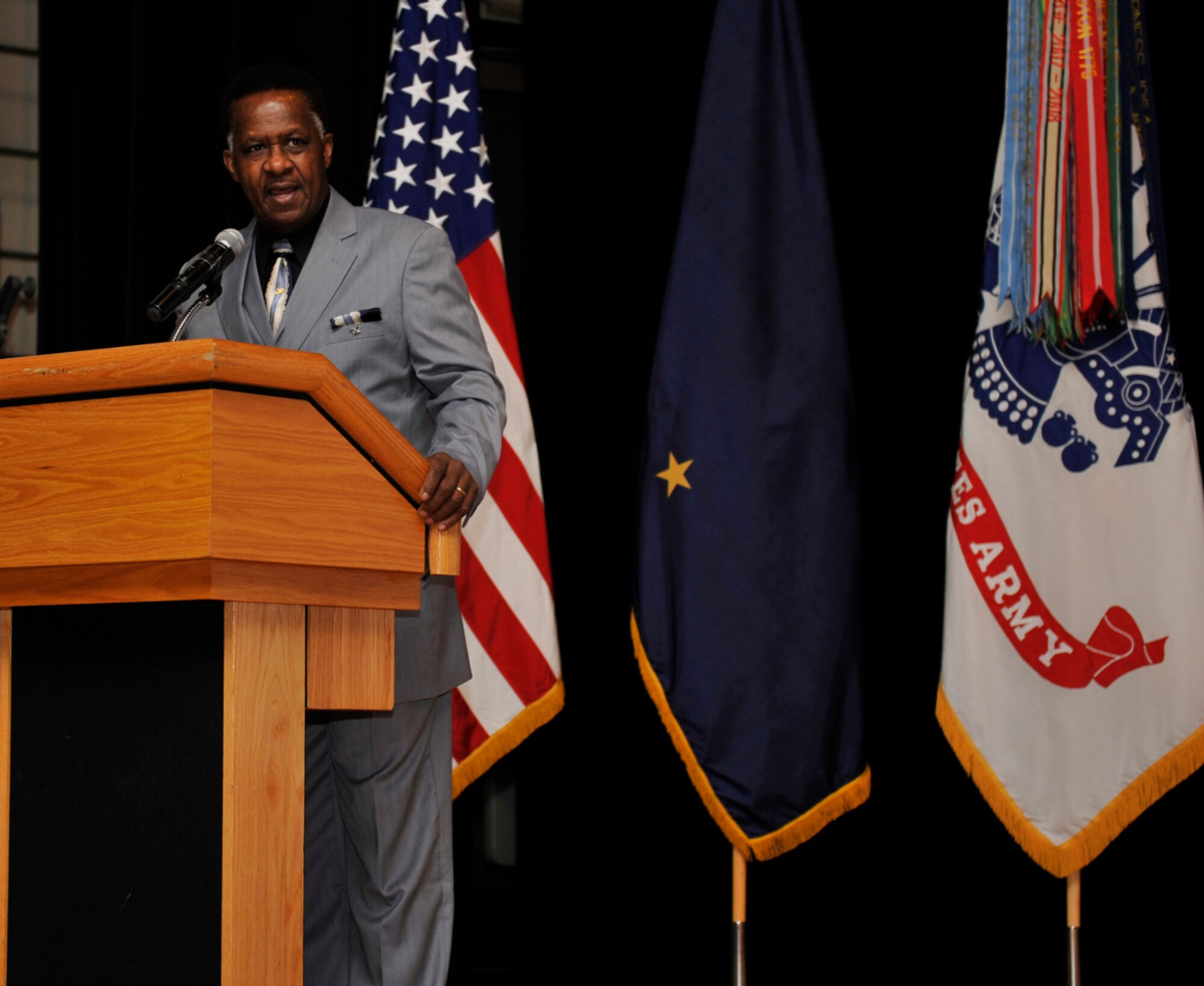 The Rev. Dr. Alonzo Patterson, president of the Anchorage Interdenominational Ministerial Alliance, speaks to military members at the Martin Luther King Jr. Day observance presentation on Jan. 22. The presentation included quotes read by volunteers from the audience. Patterson spoke about the need for today’s generation to continue the journey to universal equality. King famously said “we shall overcome;” Patterson stressed that overcoming is not something in the past but something which we should strive for in our actions. (U.S. Air Force photo/Airman 1st Class Tammie Ramsouer)