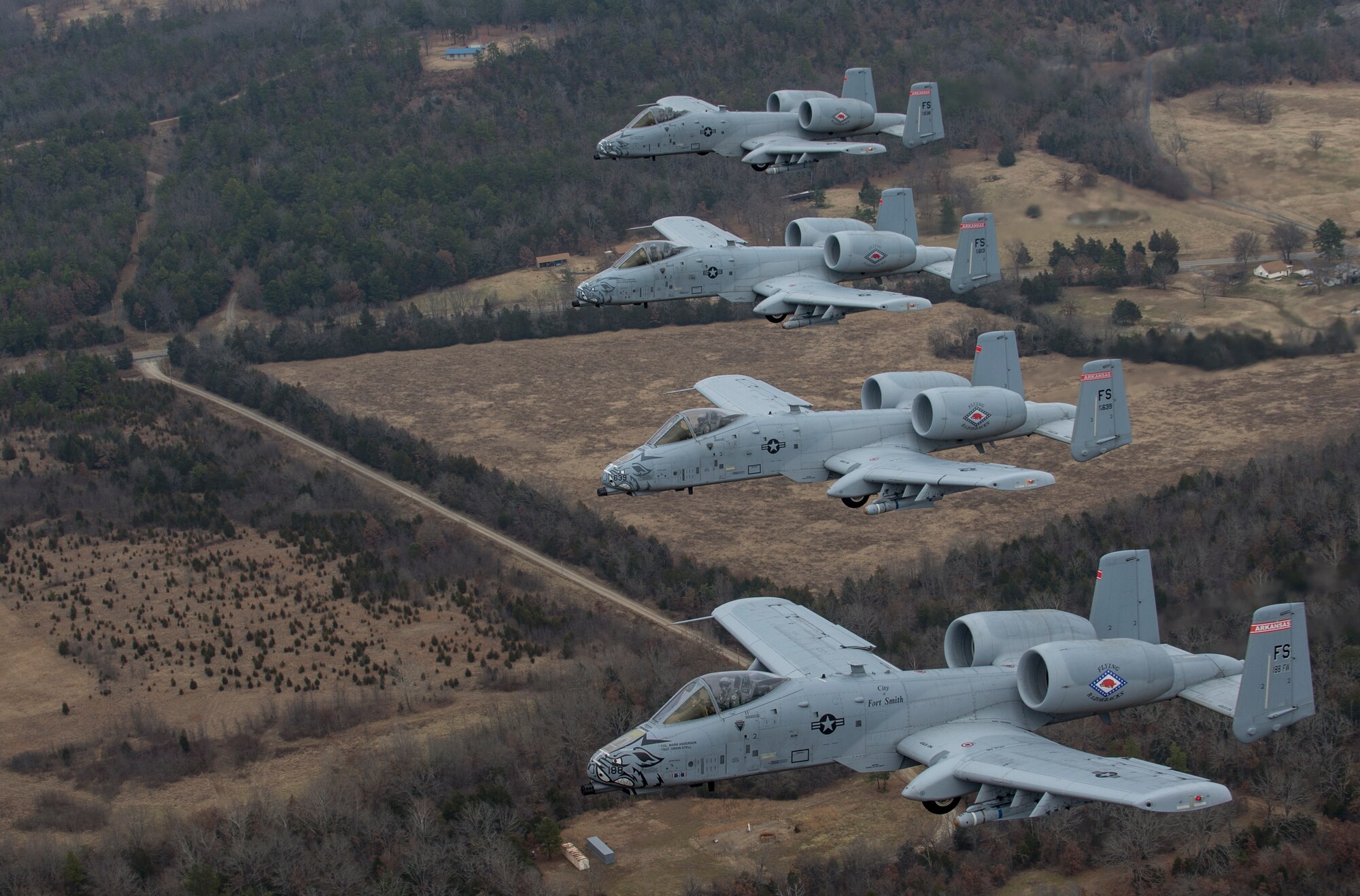 Col. Mark Anderson (Tail No. 188), 188th Fighter Wing commander; Maj. Doug Davis (Tail No. 639), 188th Detachment 1 commander; Col. Brian Burger (Tail No. 613), 188th Operations Group commander; and Capt. Wade Hendrickson (Tail No. 638) conduct a training mission Dec. 30, 2013, over Razorback Range, located at Fort Chaffee Maneuver Training Center, Ark. The photos were captured from a 189th Airlift Wing C-130 Hercules. The sortie was one of the last four-ship training missions that will be conducted at the 188th. The wing is currently transitioning from a fighter mission to an Intelligence, Surveillance and Reconnaissance/remotely piloted aircraft (MQ-9 Reaper) mission that will also feature a space-focused targeting squadron. The 188th has divested two A-10C Thunderbolt II “Warthogs” per month since September 2013. The last Warthog is slated to leave the 188th in June 2014. The 188th has flown A-10s since April 2007 and has had assigned aircraft on site since 1953. June will mark the first time in unit’s 60-year history that no assigned military aircraft will be parked on the flightline at Ebbing Air National Guard Base, Fort Smith, Ark. (U.S. Air Force photo by Senior Airman Matthew Bruch)