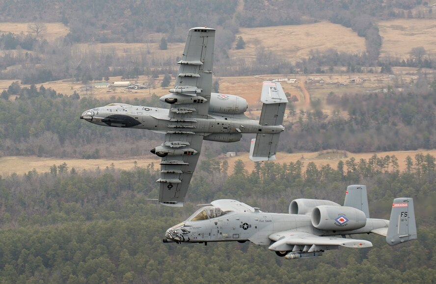 Col. Mark Anderson (Tail No. 188), 188th Fighter Wing commander, and Maj. Doug Davis (Tail No. 639), 188th Detachment 1 commander, conduct a training mission Dec. 30, 2013, over Razorback Range, located at Fort Chaffee Maneuver Training Center, Ark. The photos were captured from a 189th Airlift Wing C-130 Hercules. The sortie was one of the last four-ship training missions that will be conducted at the 188th. The wing is currently transitioning from a fighter mission to an Intelligence, Surveillance and Reconnaissance/remotely piloted aircraft (MQ-9 Reaper) mission that will also feature a space-focused targeting squadron. The 188th has divested two A-10C Thunderbolt II “Warthogs” per month since September 2013. The last Warthog is slated to leave the 188th in June 2014. The 188th has flown A-10s since April 2007 and has had assigned aircraft on site since 1953. June will mark the first time in unit’s 60-year history that no assigned military aircraft will be parked on the flightline at Ebbing Air National Guard Base, Fort Smith, Ark. (U.S. Air Force photo by Senior Airman Matthew Bruch)