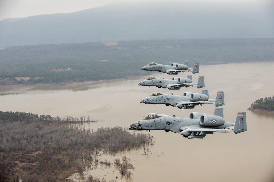 Col. Mark Anderson (Tail No. 188), 188th Fighter Wing commander; Maj. Doug Davis (Tail No. 639), 188th Detachment 1 commander; Col. Brian Burger (Tail No. 613), 188th Operations Group commander; and Capt. Wade Hendrickson (Tail No. 638) conduct a training mission Dec. 30, 2013, over Razorback Range, located at Fort Chaffee Maneuver Training Center, Ark. The photos were captured from a 189th Airlift Wing C-130 Hercules. The sortie was one of the last four-ship training missions that will be conducted at the 188th. The wing is currently transitioning from a fighter mission to an Intelligence, Surveillance and Reconnaissance/remotely piloted aircraft (MQ-9 Reaper) mission that will also feature a space-focused targeting squadron. The 188th has divested two A-10C Thunderbolt II “Warthogs” per month since September 2013. The last Warthog is slated to leave the 188th in June 2014. The 188th has flown A-10s since April 2007 and has had assigned aircraft on site since 1953. June will mark the first time in unit’s 60-year history that no assigned military aircraft will be parked on the flightline at Ebbing Air National Guard Base, Fort Smith, Ark. (U.S. Air Force photo by Senior Airman Matthew Bruch)