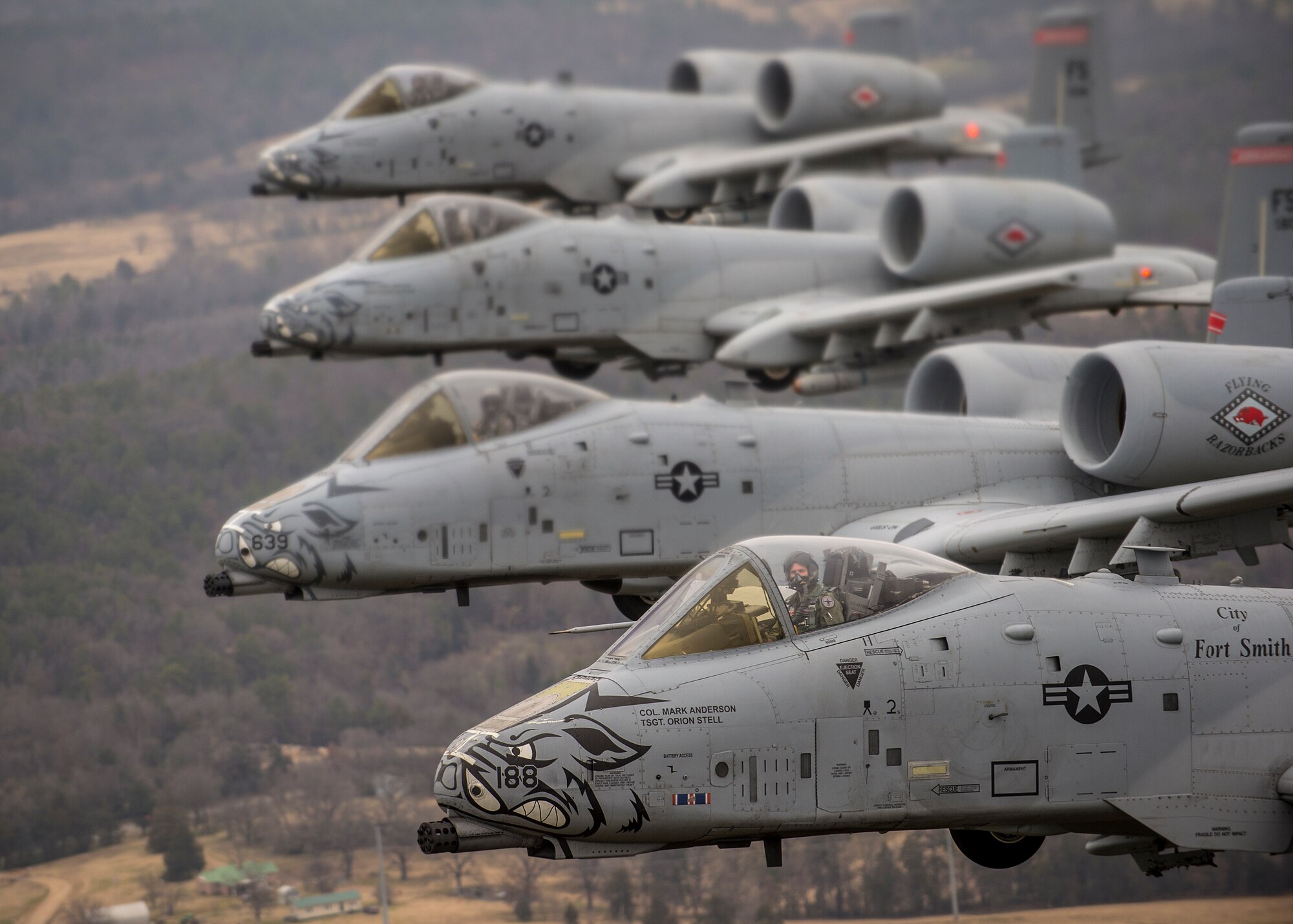 Col. Mark Anderson (Tail No. 188), 188th Fighter Wing commander; Maj. Doug Davis (Tail No. 639), 188th Detachment 1 commander; Col. Brian Burger (Tail No. 613), 188th Operations Group commander; and Capt. Wade Hendrickson (Tail No. 638) conduct a training mission Dec. 30, 2013, over Razorback Range, located at Fort Chaffee Maneuver Training Center, Ark. The photos were captured from a 189th Airlift Wing C-130 Hercules. The sortie was one of the last four-ship training missions that will be conducted at the 188th. The wing is currently transitioning from a fighter mission to an Intelligence, Surveillance and Reconnaissance/remotely piloted aircraft (MQ-9 Reaper) mission that will also feature a space-focused targeting squadron. The 188th has divested two A-10C Thunderbolt II “Warthogs” per month since September 2013. The last Warthog is slated to leave the 188th in June 2014. The 188th has flown A-10s since April 2007 and has had assigned aircraft on site since 1953. June will mark the first time in unit’s 60-year history that no assigned military aircraft will be parked on the flightline at Ebbing Air National Guard Base, Fort Smith, Ark. (U.S. Air Force photo by Senior Airman Matthew Bruch)