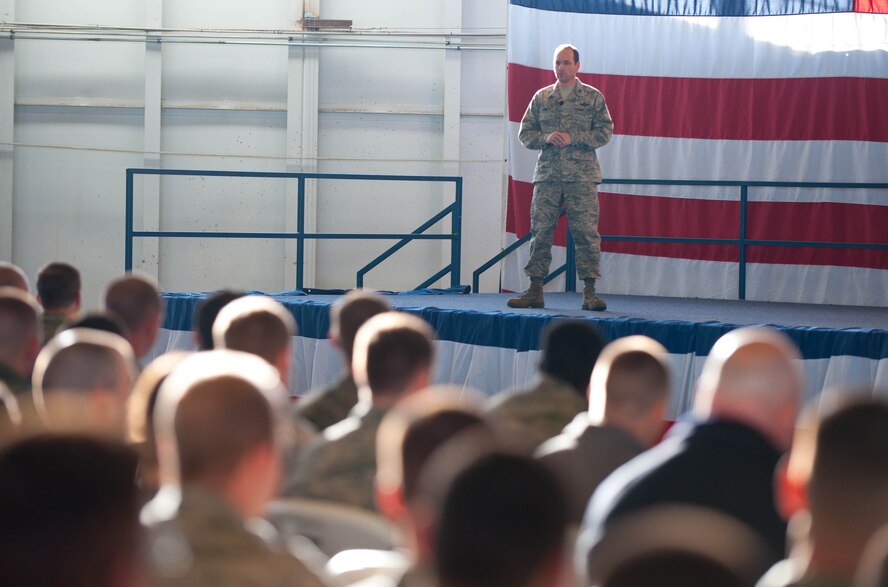 Col. Kevin Kennedy, 28th Bomb Wing commander, speaks with Ellsworth Airmen during one of two all call gatherings in the Pride Hangar at Ellsworth Air Force Base, S.D., Jan. 15, 2014. During the calls, he reflected on the base’s achievements during 2013 and encouraged Airmen to continue their efforts in 2014. (U.S. Air Force photo by Senior Airman Zachary Hada/Released)