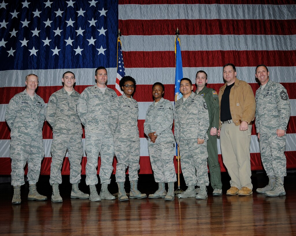 The 2013 fourth quarterly awards winners or their representatives pause for a photo on stage at Kaye Auditorium Jan. 21. (U.S. Air Force Photo/Melissa Doublin)
