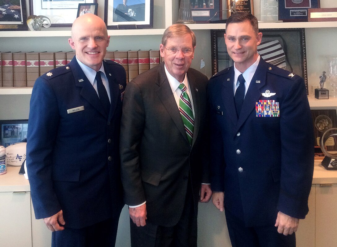 Col. Brett Clark, 94th Airlift Wing commander, and Lt. Col. James Wilson,
94th AW Public Affairs Officer, join Sen. Johnny Isakson for a photo after
discussing issues affecting Dobbins Air Reserve Base, Ga., at the senator's
Atlanta office Jan. 21, 2014. Clark provided Isakson and his staff with
updates on the C-130Hs currently arriving the 94th AW and insight on issues
to include current and future deployments, funding priorities and minor
construction projects on base. (Photo/Trey Kilpatrick)