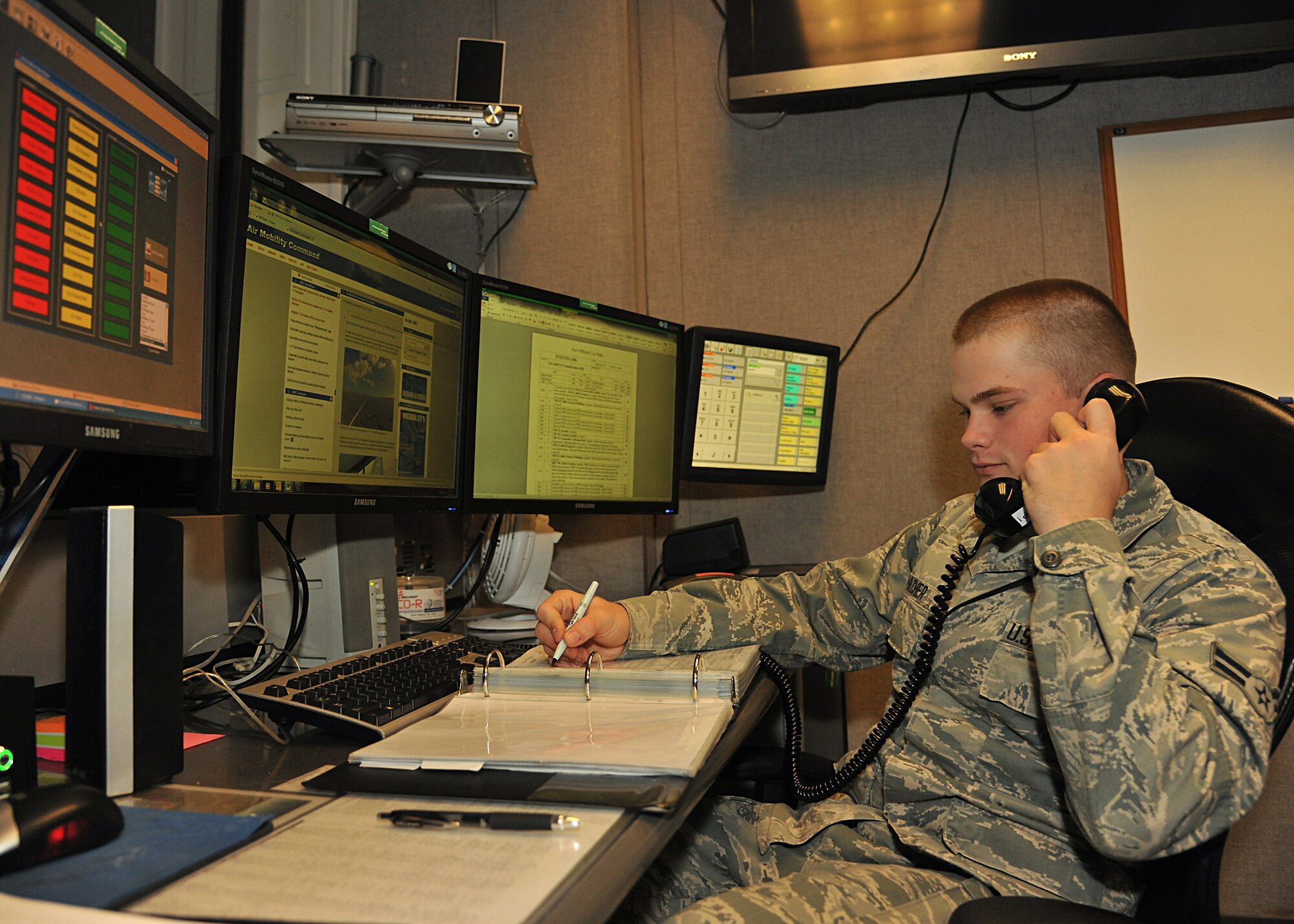 Airman 1st Class Brandon Fulcher, 319th Air Base Wing emergency action controller, takes a phone call, Oct. 24, 2013, on Grand Forks Air Force Base, N.D. Fulcher was named the Warrior of the Week for the fourth week of January 2014. (U.S. Air Force photo/Senior Airman Xavier Navarro)
