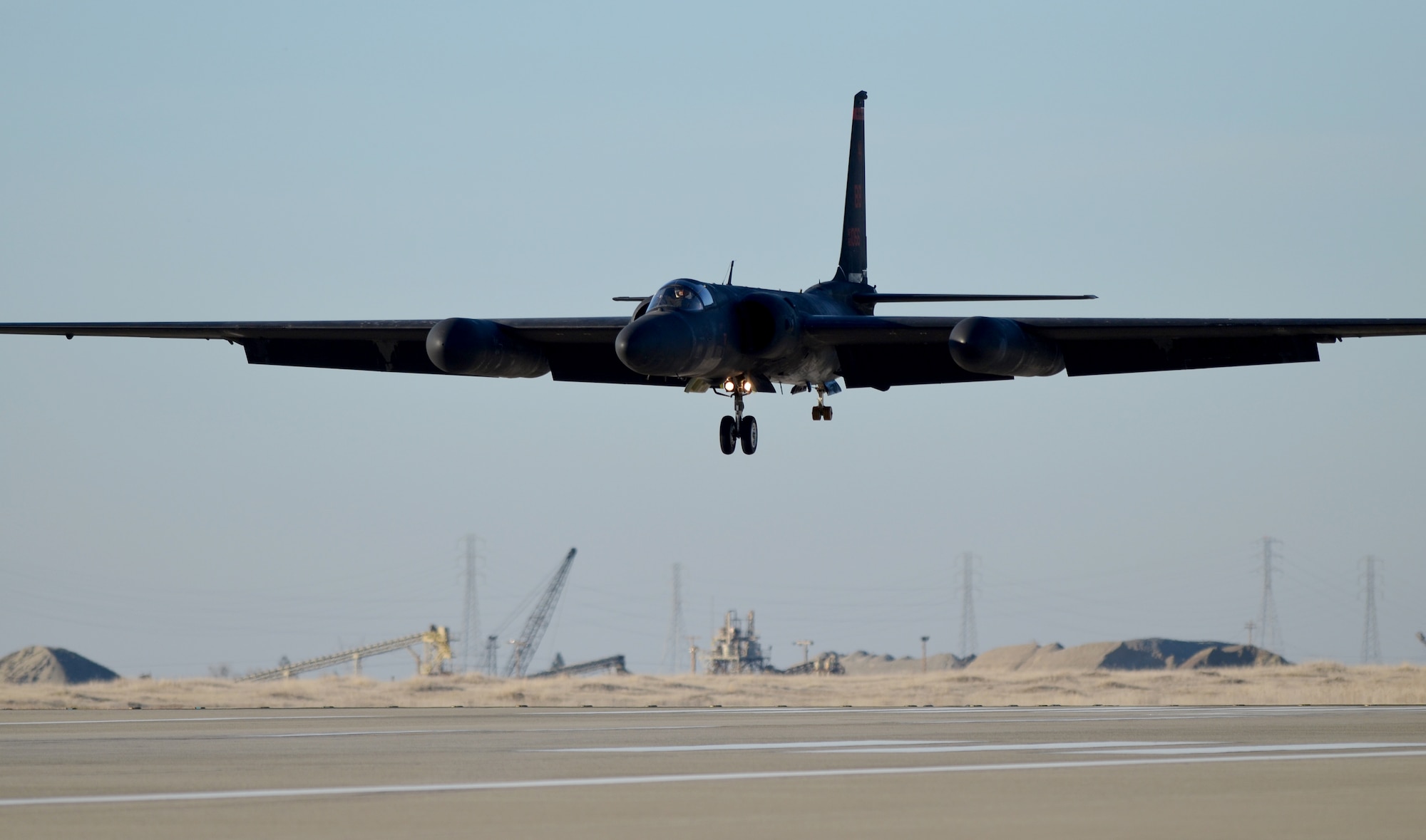 A U-2 Dragon Lady soars above the flightline at Beale Air Force Base, Calif., Jan. 22, 2014. The low-altitude handling characteristics of the aircraft and bicycle-type landing gear require precise control during landing. (U.S. Air Force photo by Airman 1st Class Bobby Cummings/Released)