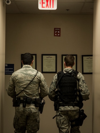Staff Sgt. Kevin Smith, 628th Security Forces Squadron patrolman, and Airman 1st Class Trey Weston, 628th SFS entry controller to search, begin an eight to 10 hour patrol Dec. 22, 2013, at Joint Base Charleston – Air Base, S.C. 628th SFS patrolmen carry M-4 carbine rifles, 9mm pistols, pepper spray and Tasers to protect the base from attack or to detain uncooperative suspects. (U.S. Air Force photo/ Senior Airman Dennis Sloan)