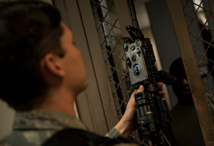 Staff Sgt. Kevin Smith, 628th Security Forces Squadron patrolman, checks out an M-4 carbine rifle from the Armory before beginning an eight to 10 hour patrol Dec. 22, 2013, at Joint Base Charleston – Air Base, S.C. (U.S. Air Force photo/ Senior Airman Dennis Sloan)
