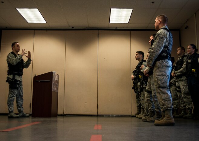 Staff Sgt. Kevin Smith, 628th Security Forces Squadron patrolman, checks out an M-4 carbine rifle from the Armory before beginning an eight to 10 hour patrol Dec. 22, 2013, at Joint Base Charleston – Air Base, S.C. (U.S. Air Force photo/ Senior Airman Dennis Sloan)