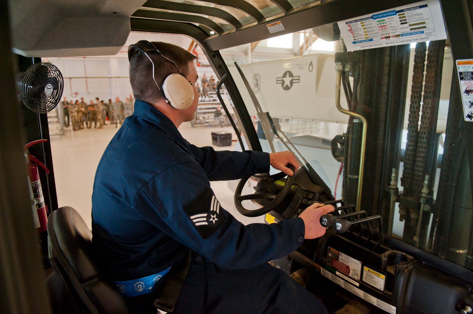 Senior Airman Matthew Wiram, 6th Aircraft Maintenance Unit assistant crew chief, opens the crate containing an MQ-1 Predator during a build-team demonstration at Holloman Air Force Base, N.M., Jan. 17. The MQ-1 build team demonstrates the airmen’s ability to build and prepare an MQ-1 after delivery. The build team travels to different locations to showcase the expedient process of assembly, which on average takes just over half an hour to complete. (U.S. Air Force photo by Airman 1st Class Aaron Montoya / Released)