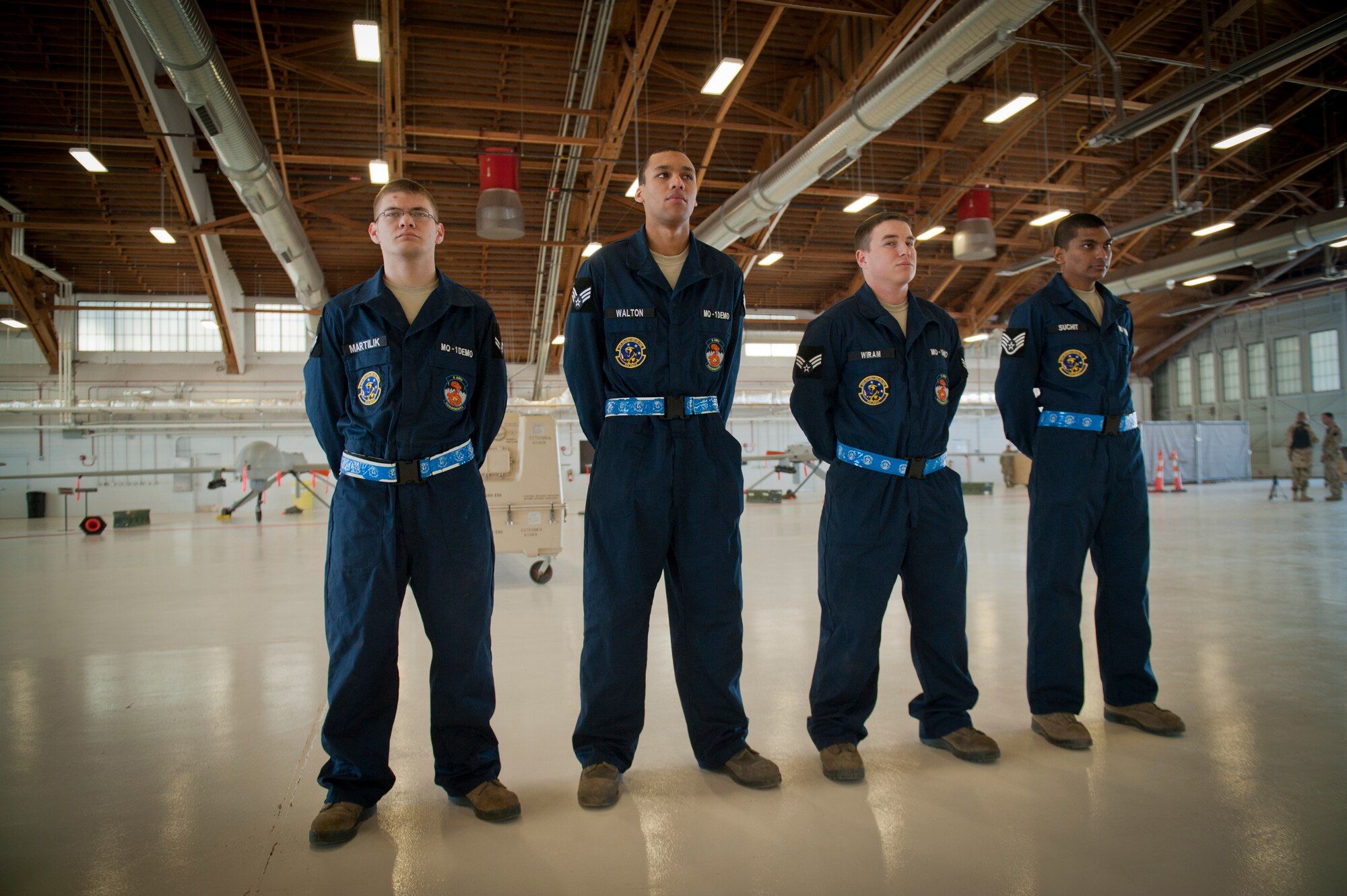 The MQ-1 Predator build team prepares to demonstrate the build process at Holloman Air Force Base, N.M., Jan. 17. The MQ-1 build team demonstrates the airmen’s ability to build and prepare an MQ-1 after delivery. The build team travels to different locations to showcase the expedient process of assembly, which on average takes just over half an hour to complete. (U.S. Air Force photo by Airman 1st Class Aaron Montoya / Released)