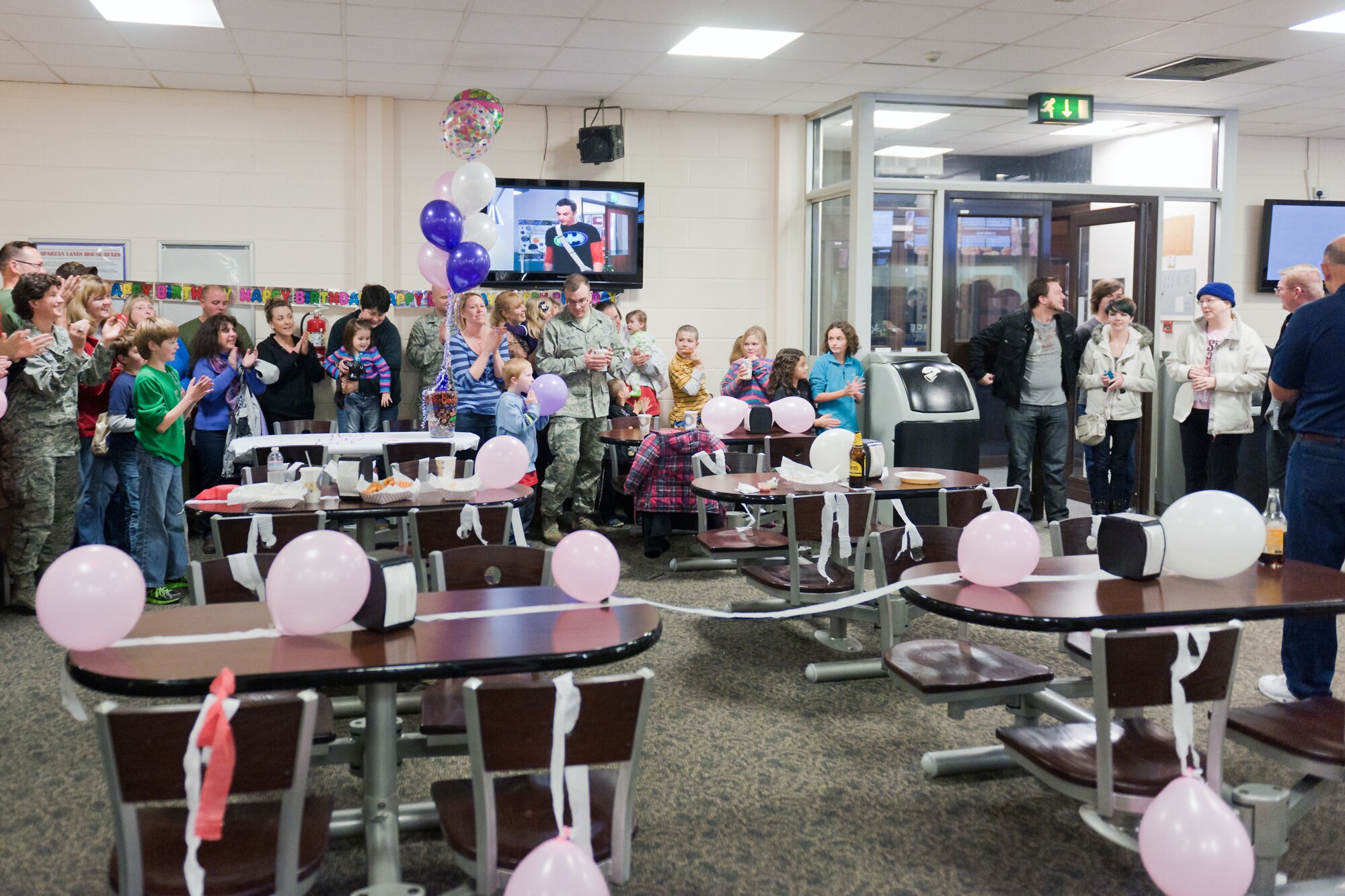 RAF ALCONBURY, United Kingdom – More than 120 members of the 501st Combat Support Wing and its Mission Partners gather for a surprise birthday party for Bonnie Ogden at the base bowling center after a chemotherapy treatment Oct. 24, 2013. (U.S. Air Force Photo Staff Sgt. Brian Stives)