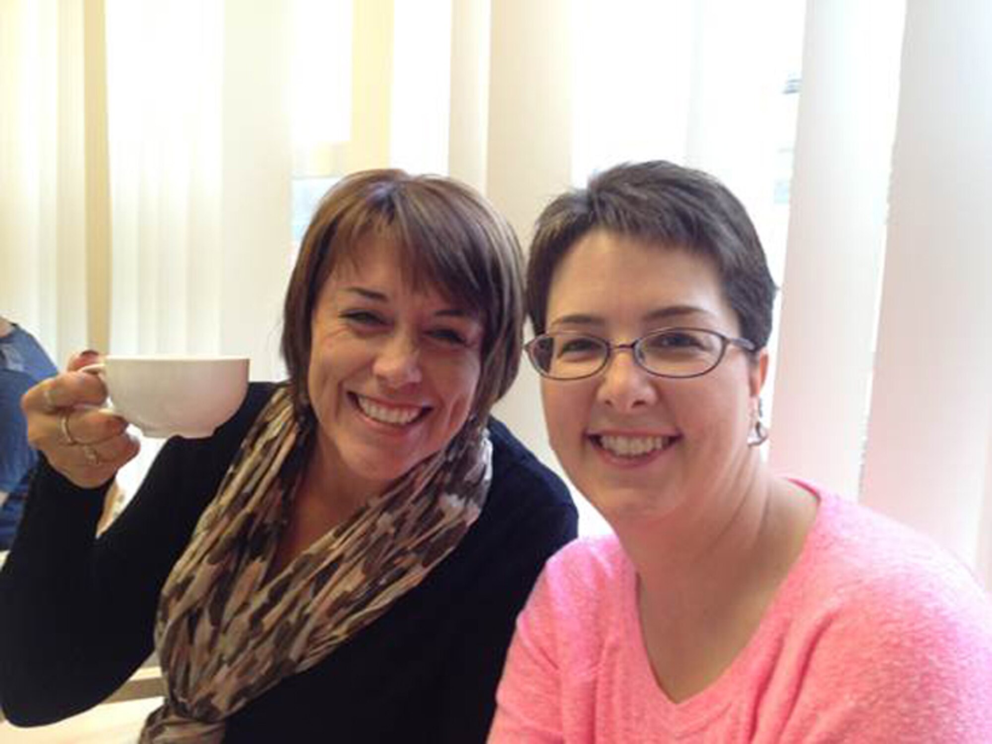 RAF ALCONBURY, United Kingdom – Stephanie Burgess (left), spouse of Lt. Col. Cornell Burgess, 423rd Force Support Squadron commander, accompanies Bonnie Ogden to her first chemotherapy treatment. (Photo courtesy Chief Master Sgt. Michael Ogden)