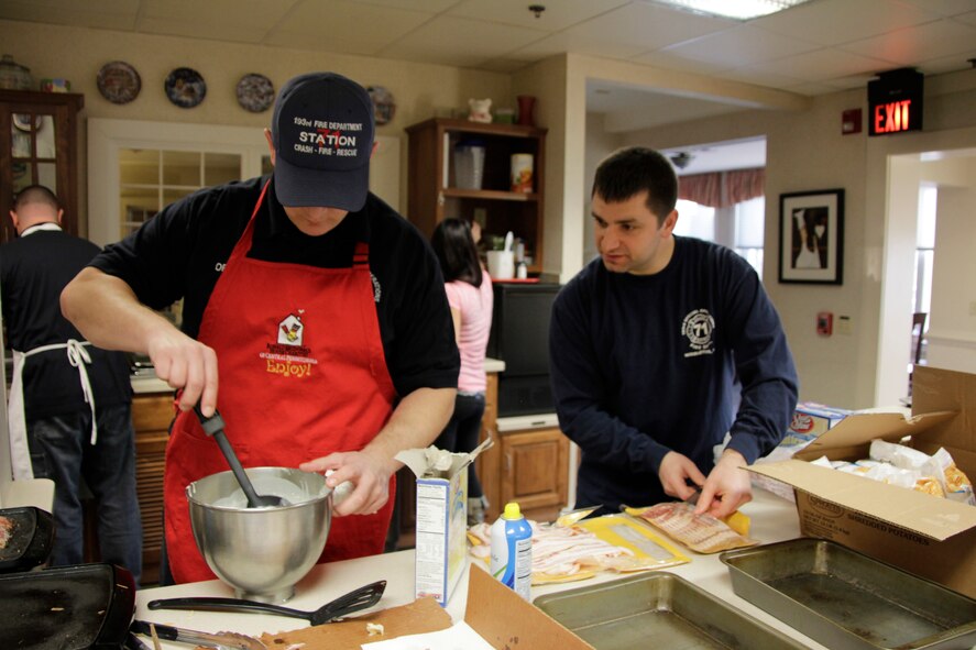 As a way of giving back to the community, John Orsulak, left, and Staff Sgt. Derrick Dimitris, 193rd Special Operations Wing firefighters, prepare breakfast for guests of Ronald McDonald House. Jan. 17, 2014 was the second time that they and their coworkers volunteered their time at the Ronald McDonald House in Hershey, Pa. (U.S. Air National Guard photo by Tech. Sgt. Culeen Shaffer/Released)