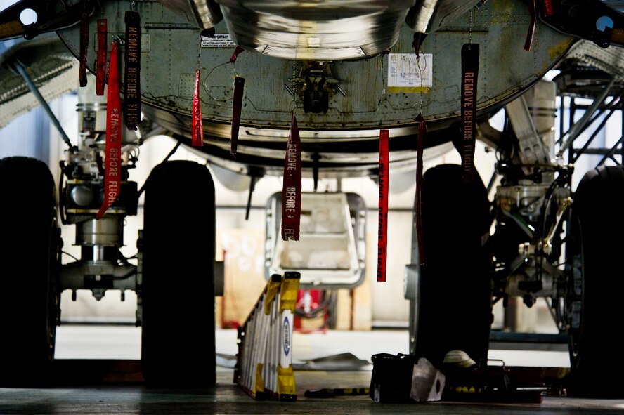 A weapons load crew from the 5th Aircraft Maintenance Squadron loads an AGM 86B air-launched cruise trainer missile on a B-52H Stratofortress at Minot Air Force Base, N.D. Jan. 16, 2014.As part of Air Force Global Strike Command, load crews work endlessly to preserve our nation’s security by providing combat-ready forces for nuclear deterrence and global strike operations. (U.S. Air Force photo/Senior Airman Brittany Y. Auld)