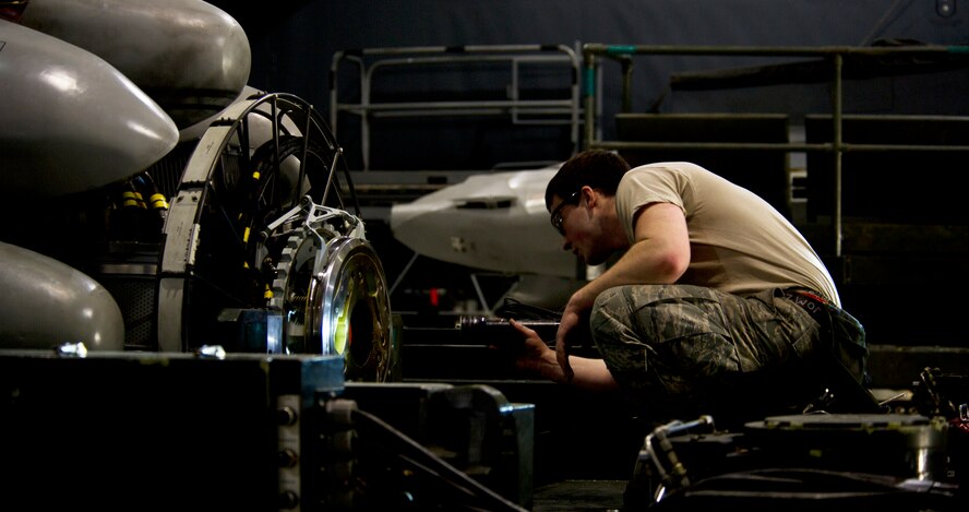 Airman 1st Class Alan Johnson, 5th Aircraft Maintenance Squadron weapons load crew member, inspects an AGM 86B air-launched cruise trainer missile before loading it in a B-52H Stratofortress at Minot Air Force Base, N.D., Jan. 14, 2013. As part of Air Force Global Strike Command, load crews work endlessly to preserve our nation’s security by providing combat-ready forces for nuclear deterrence and global strike operations. (U.S. Air Force photo/Senior Airman Brittany Y. Auld)