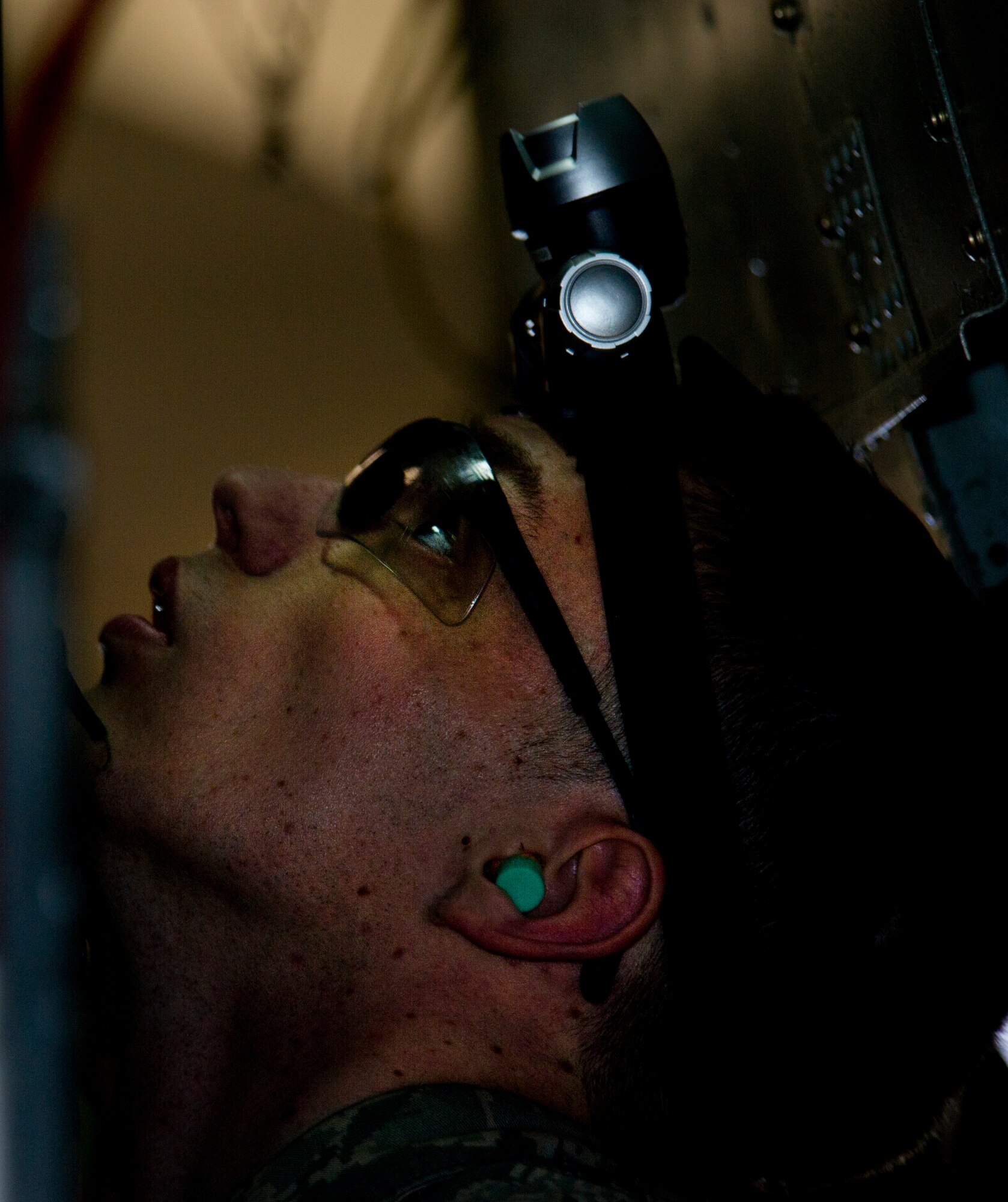 Airman 1st Class John Thompson, 5th Aircraft Maintenance Squadron weapons load crew member, prepares to load an AGM 86B air-launched cruise trainer missile in a B-52H Stratofortress at Minot Air Force Base, N.D., Jan. 14, 2013. As part of Air Force Global Strike Command, load crews work endlessly to preserve our nation’s security by providing combat-ready forces for nuclear deterrence and global strike operations. (U.S. Air Force photo/Senior Airman Brittany Y. Auld)