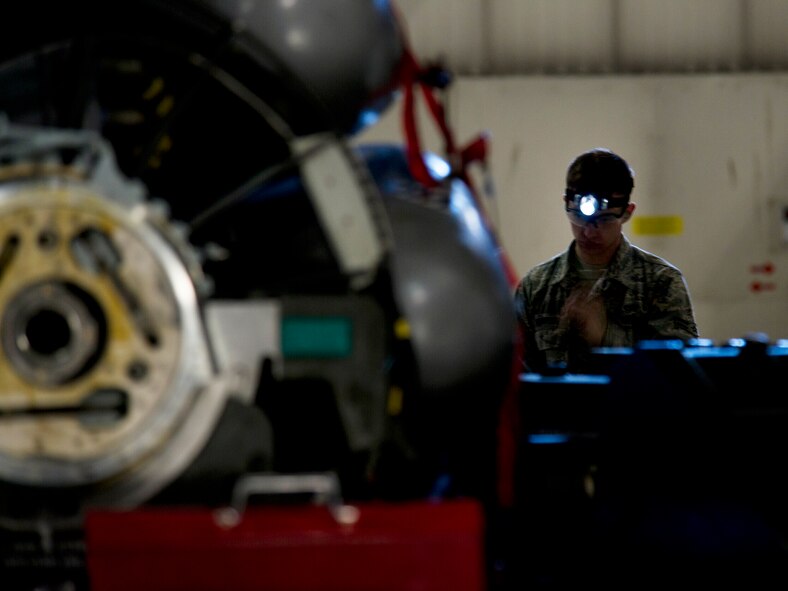 Airman 1st Class John Thompson, 5th Aircraft Maintenance Squadron weapons load crew member, prepares to load an AGM 86B air-launched cruise trainer missile in a B-52H Stratofortress at Minot Air Force Base, N.D., Jan. 14, 2013. As part of Air Force Global Strike Command, load crews work endlessly to preserve our nation’s security by providing combat-ready forces for nuclear deterrence and global strike operations. (U.S. Air Force photo/Senior Airman Brittany Y. Auld)
