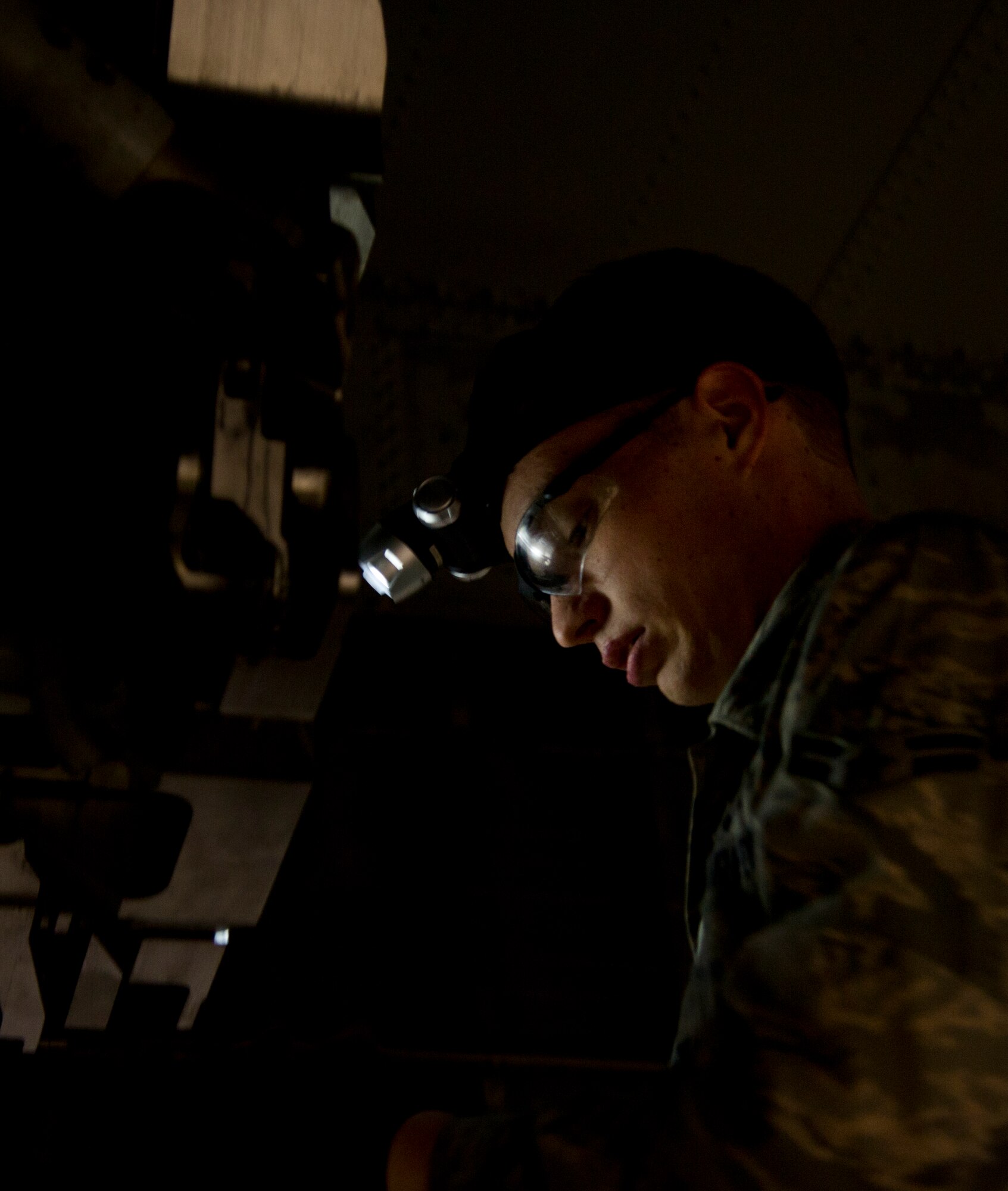 Airman 1st Class John Thompson, 5th Aircraft Maintenance Squadron weapons load crew member, prepares to load an AGM 86B air-launched cruise trainer missile in a B-52H Stratofortress at Minot Air Force Base, N.D., Jan. 14, 2013. As part of Air Force Global Strike Command, load crews work endlessly to preserve our nation’s security by providing combat-ready forces for nuclear deterrence and global strike operations. (U.S. Air Force photo/Senior Airman Brittany Y. Auld)
