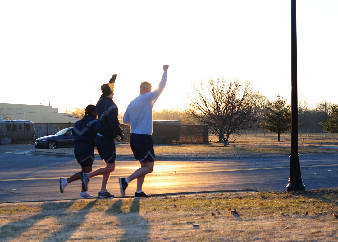 Team Andrews members pump their fists during a the Rev. Dr. Martin Luther King Jr. 5K fun run/walk here, Jan. 17, 2014. Joint Base Andrews held a 5K to commemorate the contributions King made to the equal treatment of all Americans. (U.S. Air Force photo/Airman 1st Class Aaron Stout)