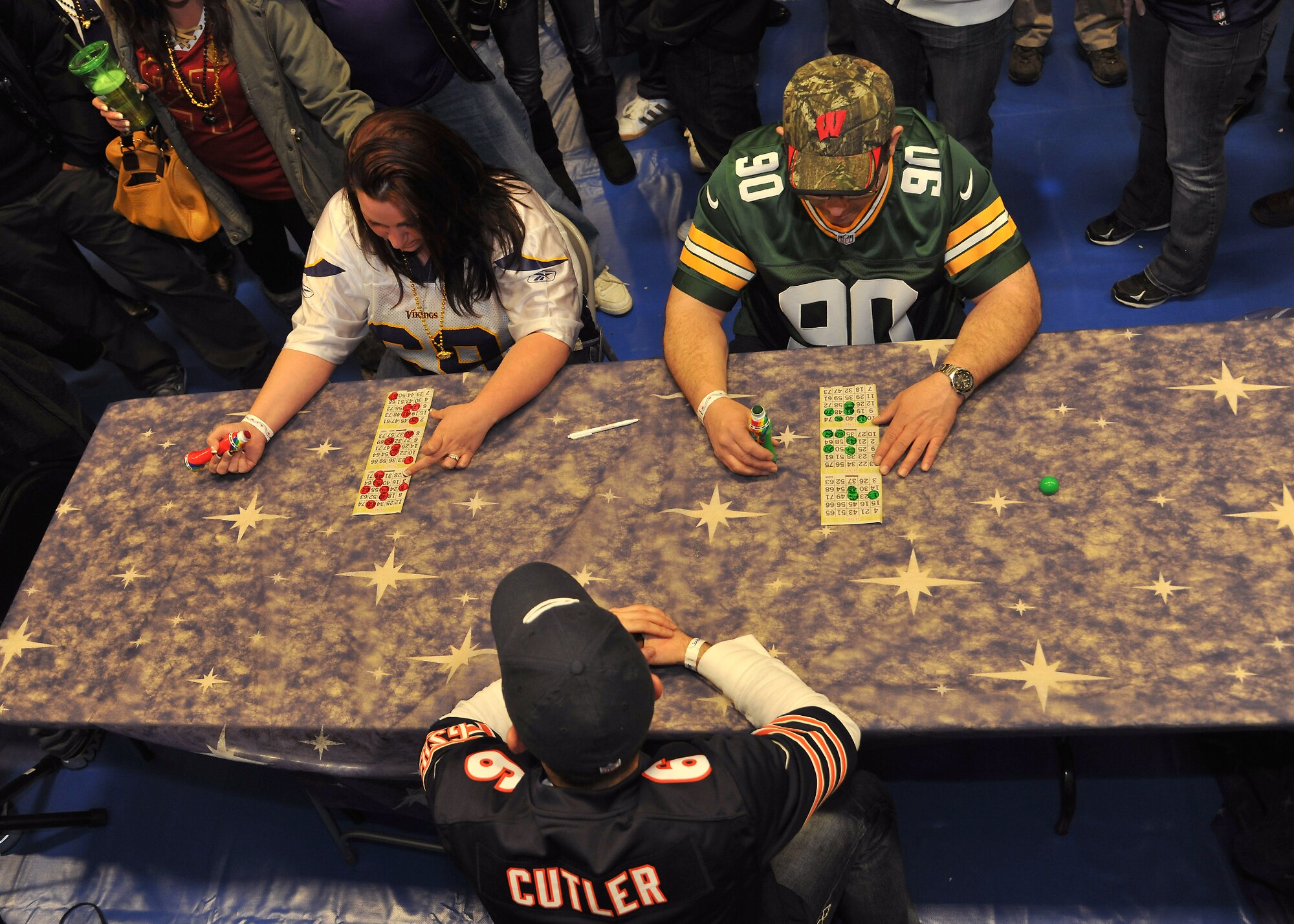 Abbey Machado (left), 319th Medical Support Squadron and Ed Prasnicky (right), 319th Force Support Squadron civilian training technician, play the final Bingo game of the night, Jan. 18, 2014 at the Fitness Center on Grand Forks Air Force Base, N.D. Prasnicky won an all-expenses-paid trip to Super Bowl XLVIII, which is scheduled to take place Feb. 2, 2014, in East Rutherford, N.J. (U.S. Air Force photo/ Senior Airman Xavier Navarro)
