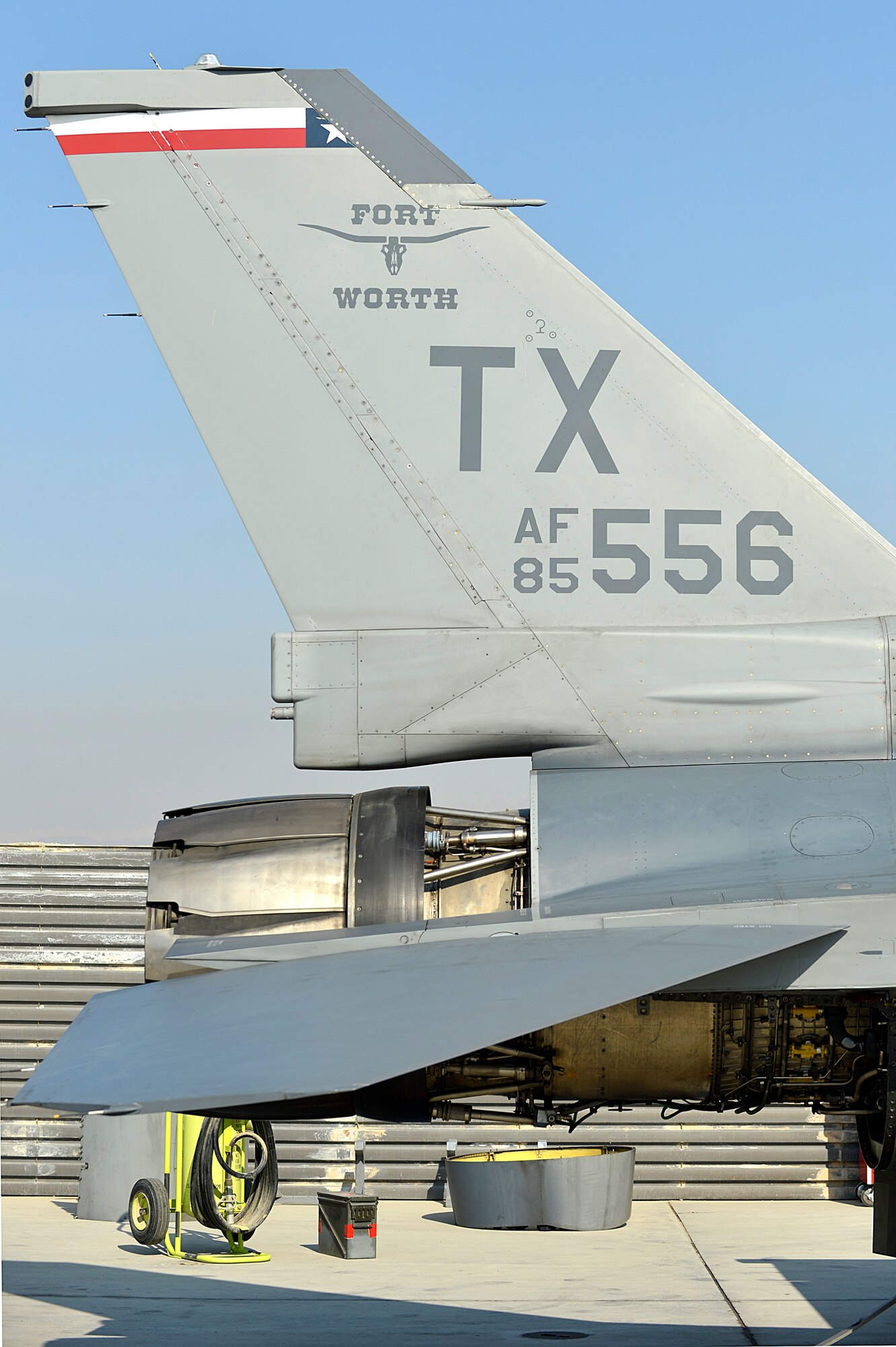An engine from an F-16 Fighting Falcon is partly removed at Bagram Airfield, Afghanistan, Jan. 22, 2014. Airmen worked to remove the engine due to a bad hydraulic line. (U.S. Air Force photo by Senior Airman Kayla Newman/Released)
