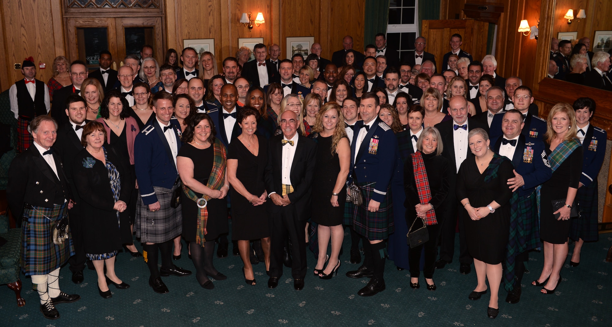 Members and guests of the British-American Committee celebrate Burns Night Jan. 18, 2014, in Middleton Hall on RAF Mildenhall, England. Burns Night honors the work of Robert Burns, the renowned Scottish poet who drafted the lyrics of "Auld Lang Syne." (U.S. Air Force photo by Airman 1st Class Preston Webb/Released)
