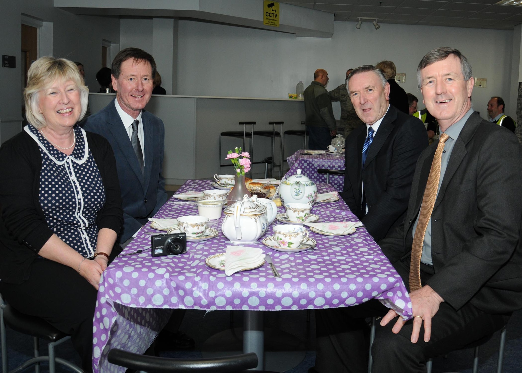 Colin Grubb, second from right, sits with his family to celebrate receiving the Imperial Service Medal Jan. 21, 2014, on RAF Mildenhall, England. Grubb worked at the 727th Air Mobility Squadron on RAF Mildenhall for 39 years with an impeccable record. The Imperial Service Medal recognizes long and faithful service in the Civil Service by an individual in an eligible grade on retirement, resignation or redundancy. The individual must have at least 25 years of meritorious service. (U.S. Air Force photo by Gina Randall/Released)