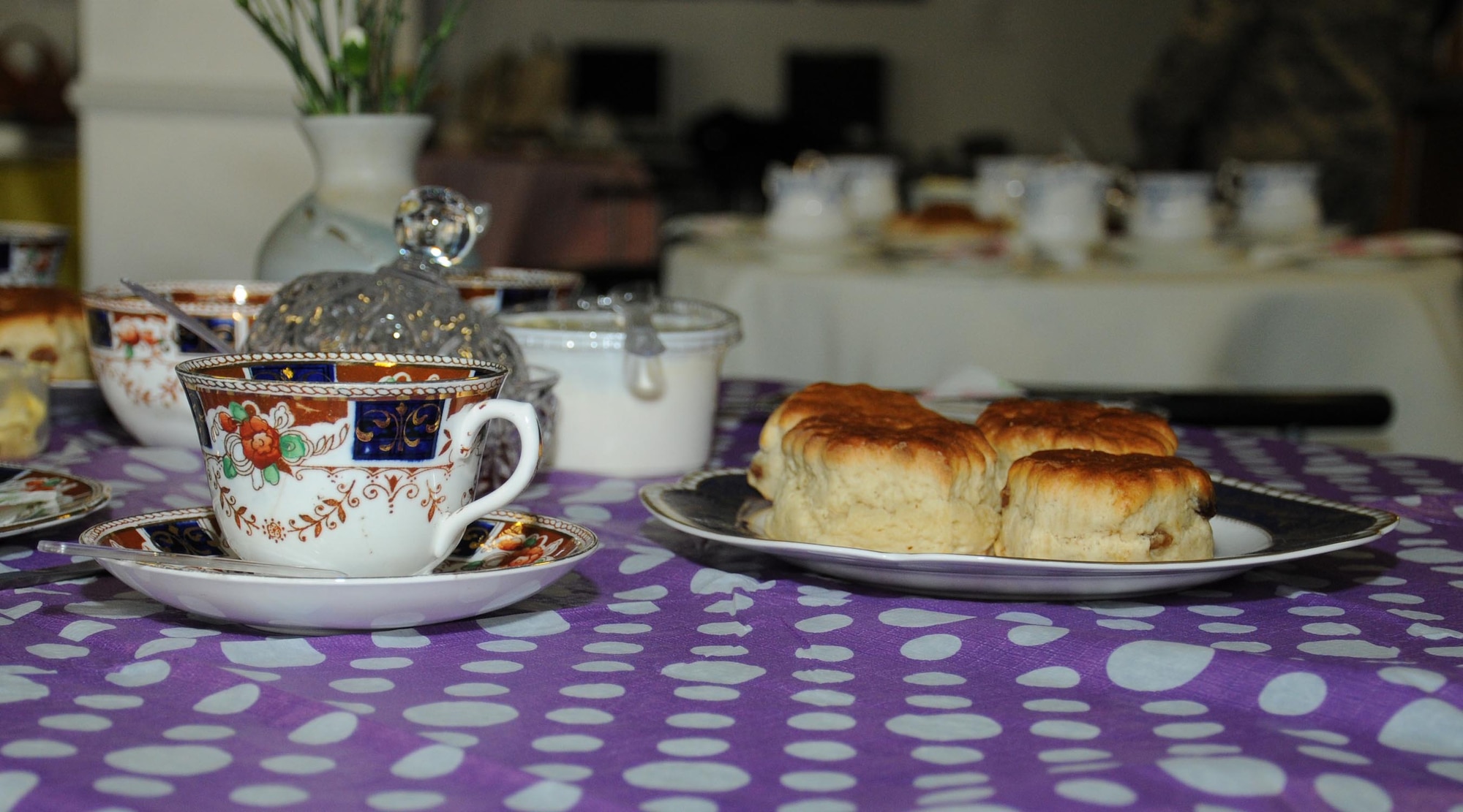 Staff from the 727th Air Mobility Squadron prepare a tea party in celebration of Colin Grubb receiving the Imperial Service Medal Jan. 21, 2014, on RAF Mildenhall, England. Grubb worked at the 727th AMS on RAF Mildenhall for 39 years with an impeccable record. The Imperial Service Medal recognizes long and faithful service in the Civil Service by an individual in an eligible grade on retirement, resignation or redundancy. The individual must have at least 25 years of meritorious service. (U.S. Air Force photo by Gina Randall/Released)