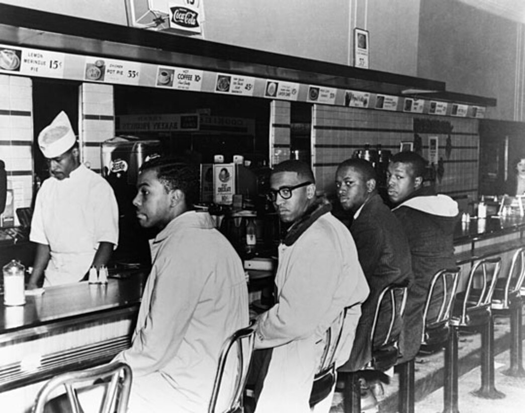 As a young college student in 1960, McNeil (far left) and three of his friends staged a protest at a lunch counter inside a Woolworth store in Greensboro, N.C. They refused to move when they were told the facility did not serve blacks. Their protest quickly spread to lunch counters in 54 cities in nine states. 