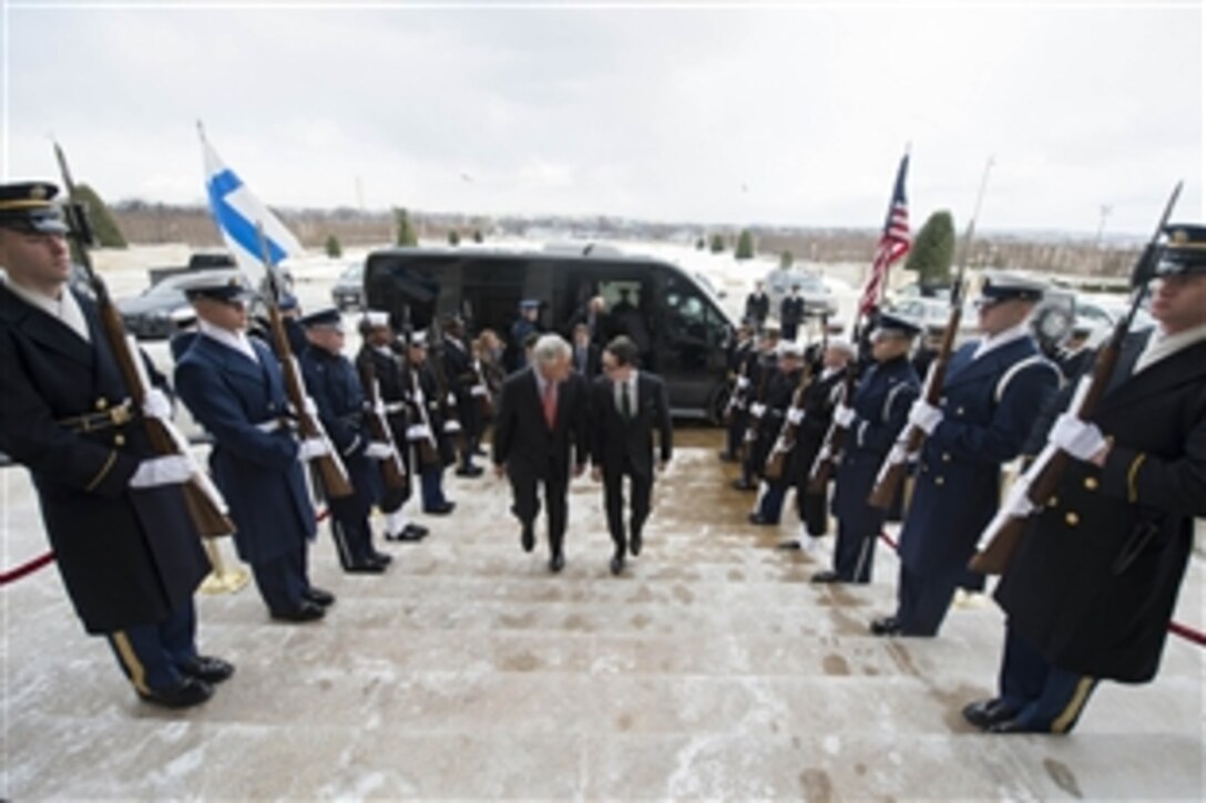 U.S. Defense Secretary Chuck Hagel, left, hosts an honor cordon for Finnish Defense Minister Carl Haglund at the Pentagon, Jan. 23, 2014. The two leaders met to discuss bilateral defense topics. 