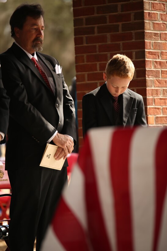 Medal of Honor recipient John James McGinty III’s son and grandson attend his funeral Jan. 23, 2014, at Beaufort National Cemetery in Beaufort, S.C. McGinty, a decorated Vietnam War hero and Parris Island veteran, died Jan. 17, 2014, in his home in Beaufort at the age of 73.
