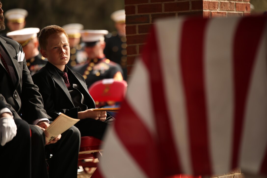Medal of Honor recipient John James McGinty III’s grandson watches his grandfather’s funeral proceedings Jan. 23, 2014, at Beaufort National Cemetery in Beaufort, S.C. McGinty, a decorated Vietnam War hero and Parris Island veteran, died Jan. 17, 2014, in his home in Beaufort at the age of 73.