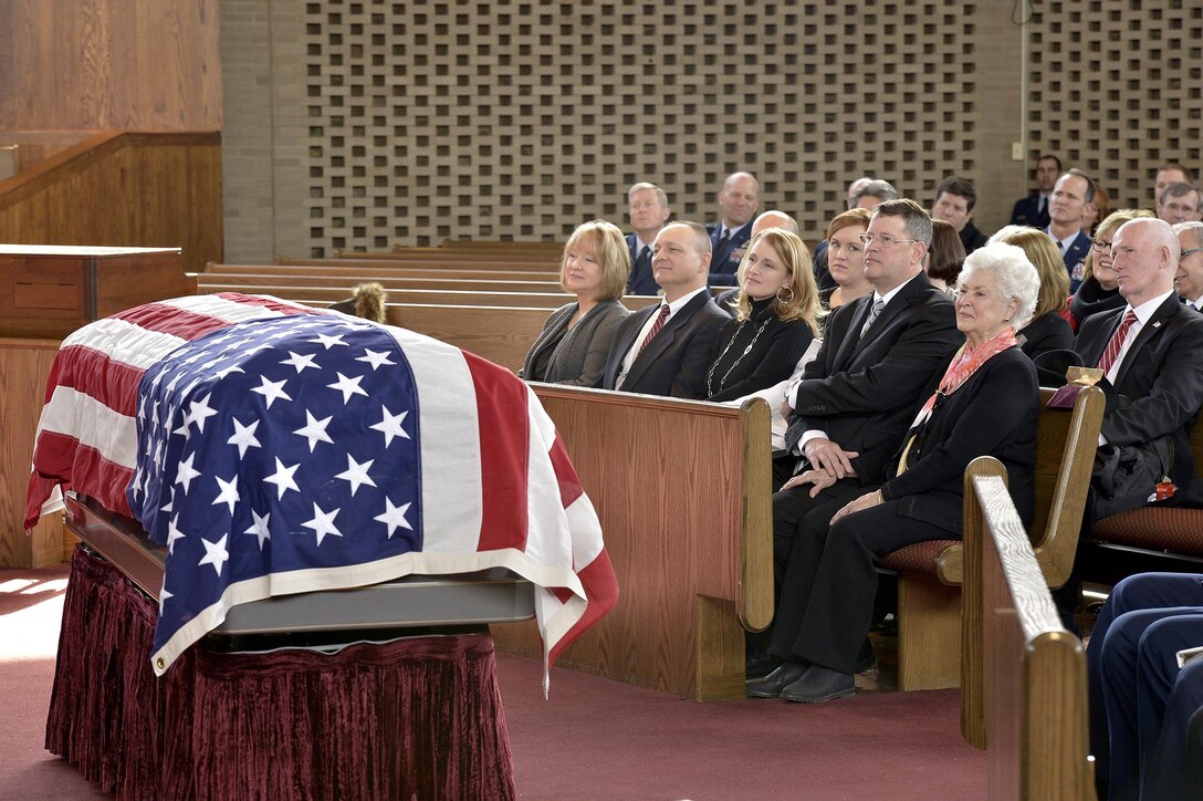 Family members of Brig. Gen. Robinson "Robbie" Risner listen to Air Force Chief of Staff Gen. Mark A. Welsh III and Ross Perot who spoke at Risner's internment ceremony at the Memorial chapel on Fort Myer, Arlington, Va., before he was laid to rest at Arlington National Cemetery, Jan. 23, 2014. Risner was one of the most celebrated pilots in Air Force history and survived seven and a half years of captivity in Hoa Lo Prison, also known as the Hanoi Hilton. (U.S. Air Force photo/Michael J. Pausic)