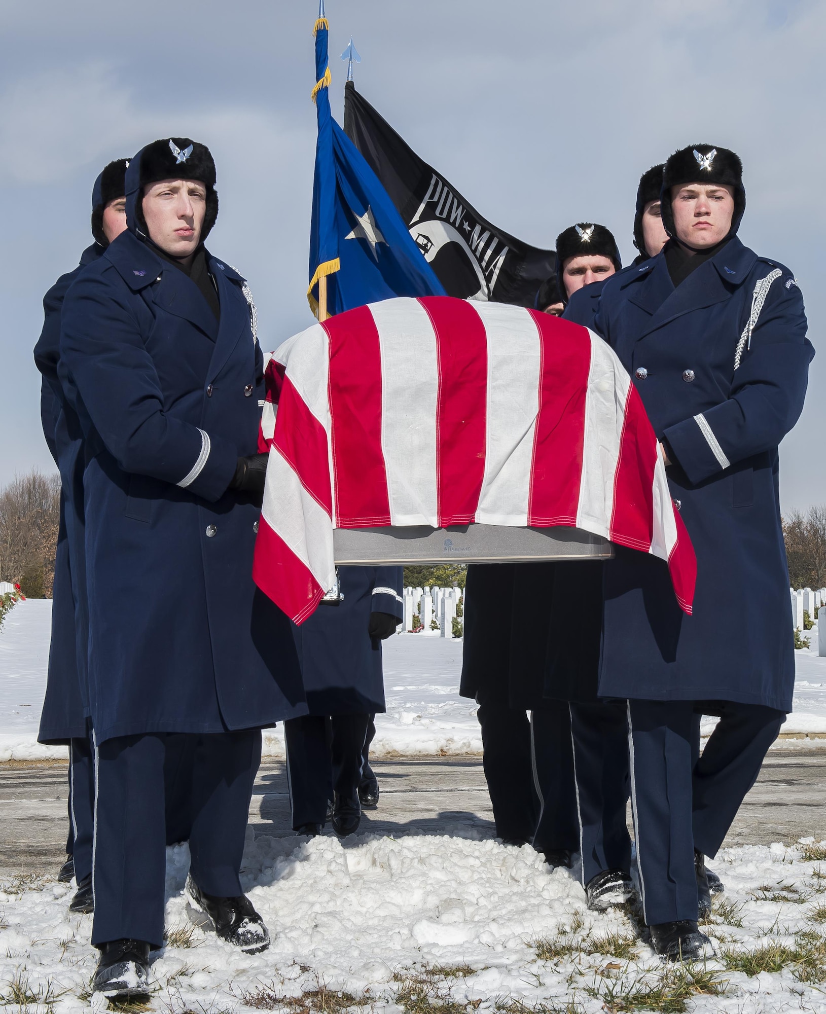 Pall Bearers from the U.S. Air Force Honor Guard carry the casket of Brig. Gen. Robinson "Robbie" Risner to his gravesite during his internment ceremony at Arlington National Cemetery, Arlington, Va., Jan. 23, 2014. Risner was the Air Force's 20th Ace and and survived  seven and a half years of captivity as a Prisoner of War (POW) in Hoa Lo Prison, a.k.a the Hanoi Hilton. during the Vietnam War. (U.S. Air Force photo/Jim Varhegyi)                                                                                                                                                                                                                                                                                                                 