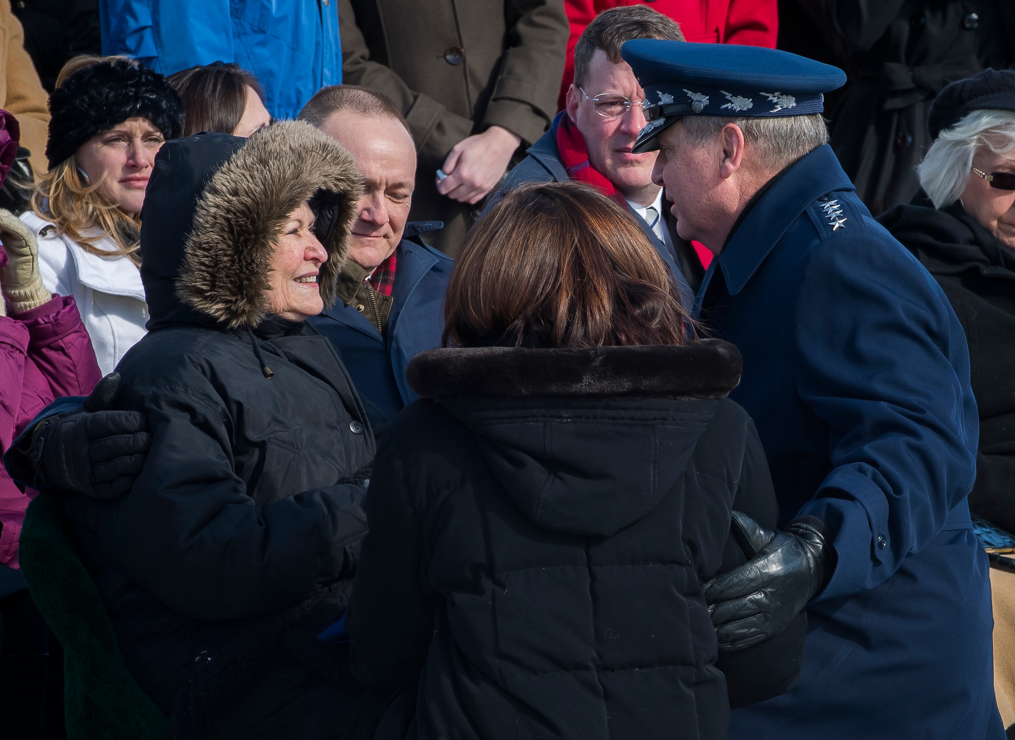 Chief of Staff Gen. Mark A. Welsh III and his wife, Betty, give their condolences to Dorothy Risner during the funeral for her husband, Brig. Gen. Robinson "Robbie" Risner, at Arlington National Cemetery, Arlington, Va., Jan. 23, 2014. Risner was the Air Force's 20th Ace and and survived  seven and a half years of captivity as a Prisoner of War (POW) in Hoa Lo Prison, a.k.a the Hanoi Hilton. during the Vietnam War. (U.S. Air Force photo/Jim Varhegyi)