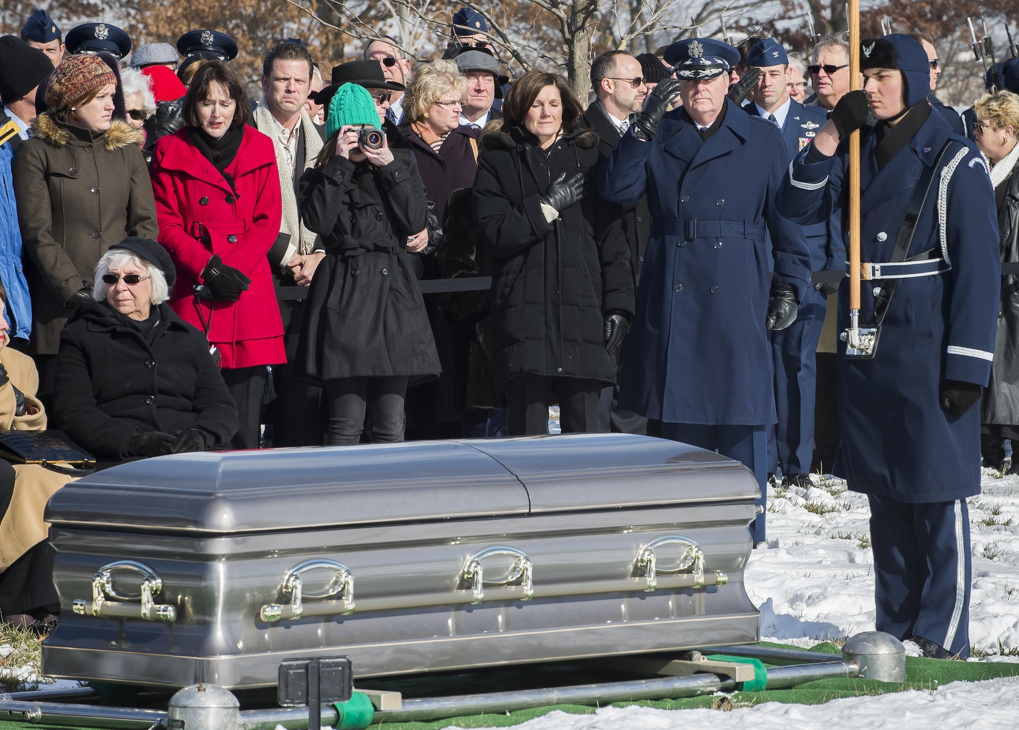 Chief of Staff Gen. Mark A. Welsh III (top left) and his wife, Betty, render honors during Brig. Gen. Robinson "Robbie" Risner's funeral at Arlington National Cemetery, Arlington, Va., Jan. 23, 2014. Risner was the Air Force's 20th Ace and and survived  seven and a half years of captivity as a Prisoner of War (POW) in Hoa Lo Prison, a.k.a the Hanoi Hilton. during the Vietnam War. (U.S. Air Force photo/Jim Varhegyi)