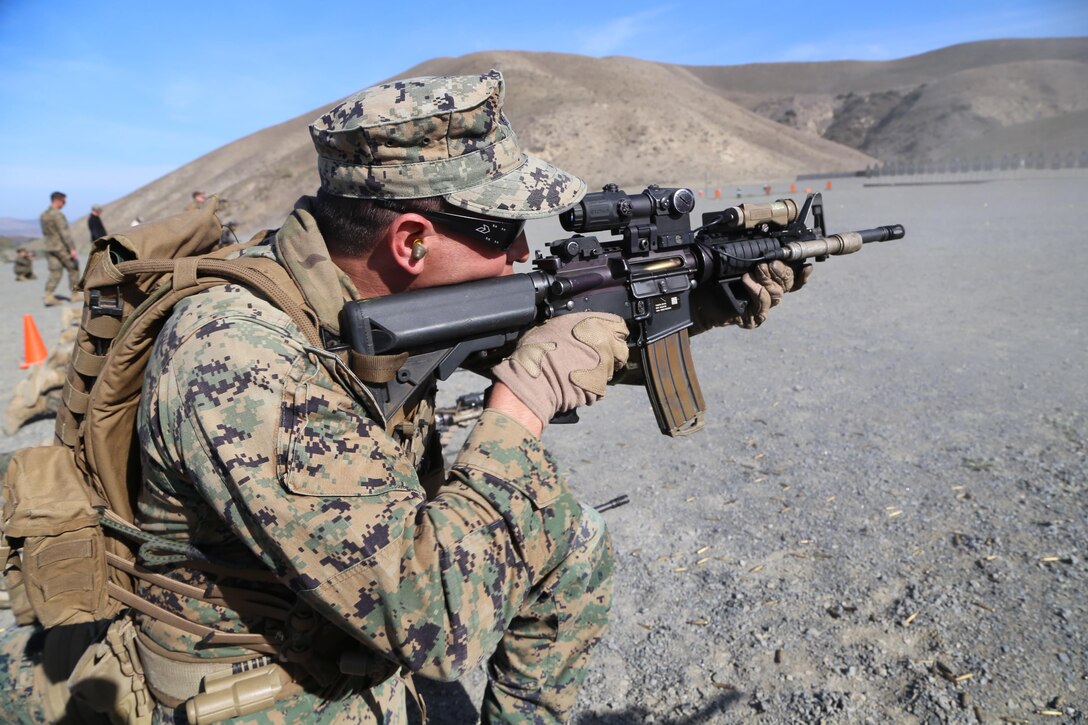 CAMP PENDLETON, Calif. – Sgt. Frank Simmons, an assistant platoon sergeant with 1st Reconnaissance Battalion, fires his weapon in the kneeling position during a live-fire exercise here Jan 23. Personnel conducted a variety of different marksmanship drills to hone and maintain close range rifle skills.    